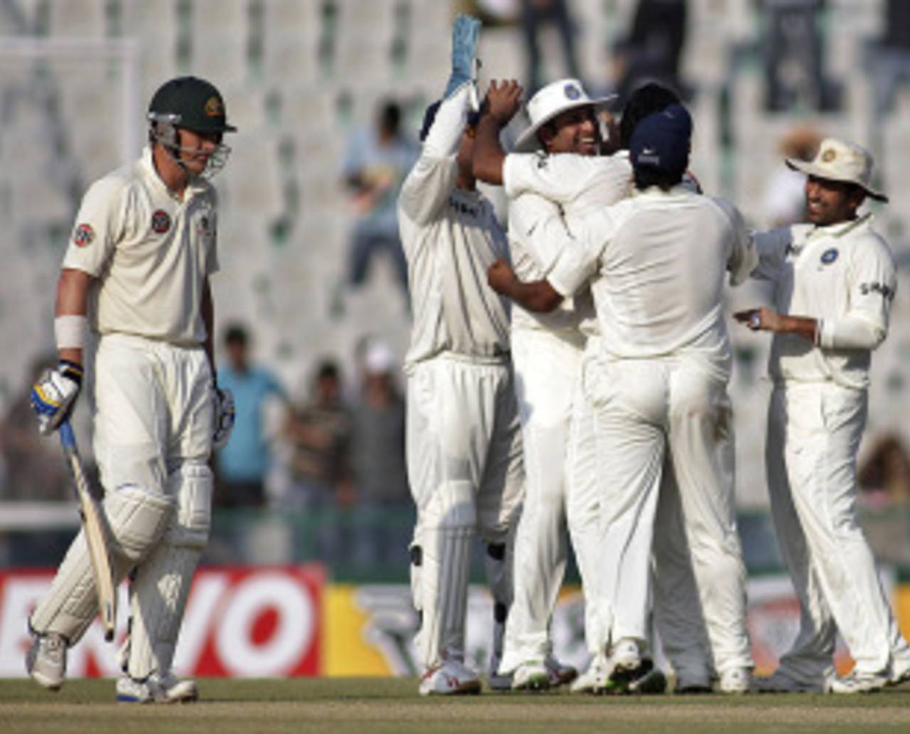 Marcus North walks back to the pavilion as India's fielders celebrate, India v Australia, 1st Test, Mohali, 1st day, October 1, 2010