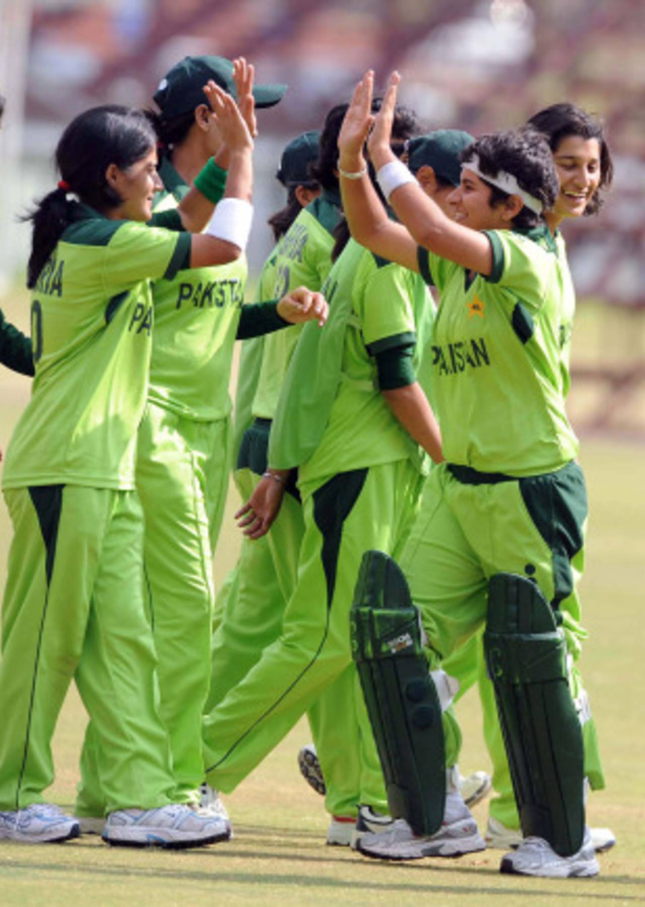 The Pakistan players celebrate on their way to an easy opening victory, Ireland Women v Pakistan Women, ICC Women's Cricket Challenge, Potchefstroom, October 6, 2010