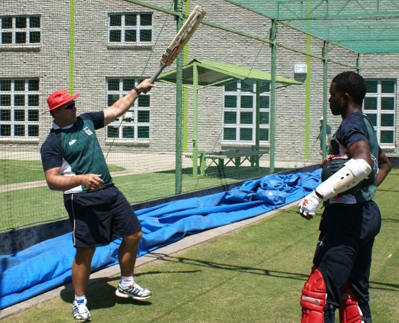 Heath Streak gives Elton Chigumbura a few pointers, Bloemfontein, October 7, 2010