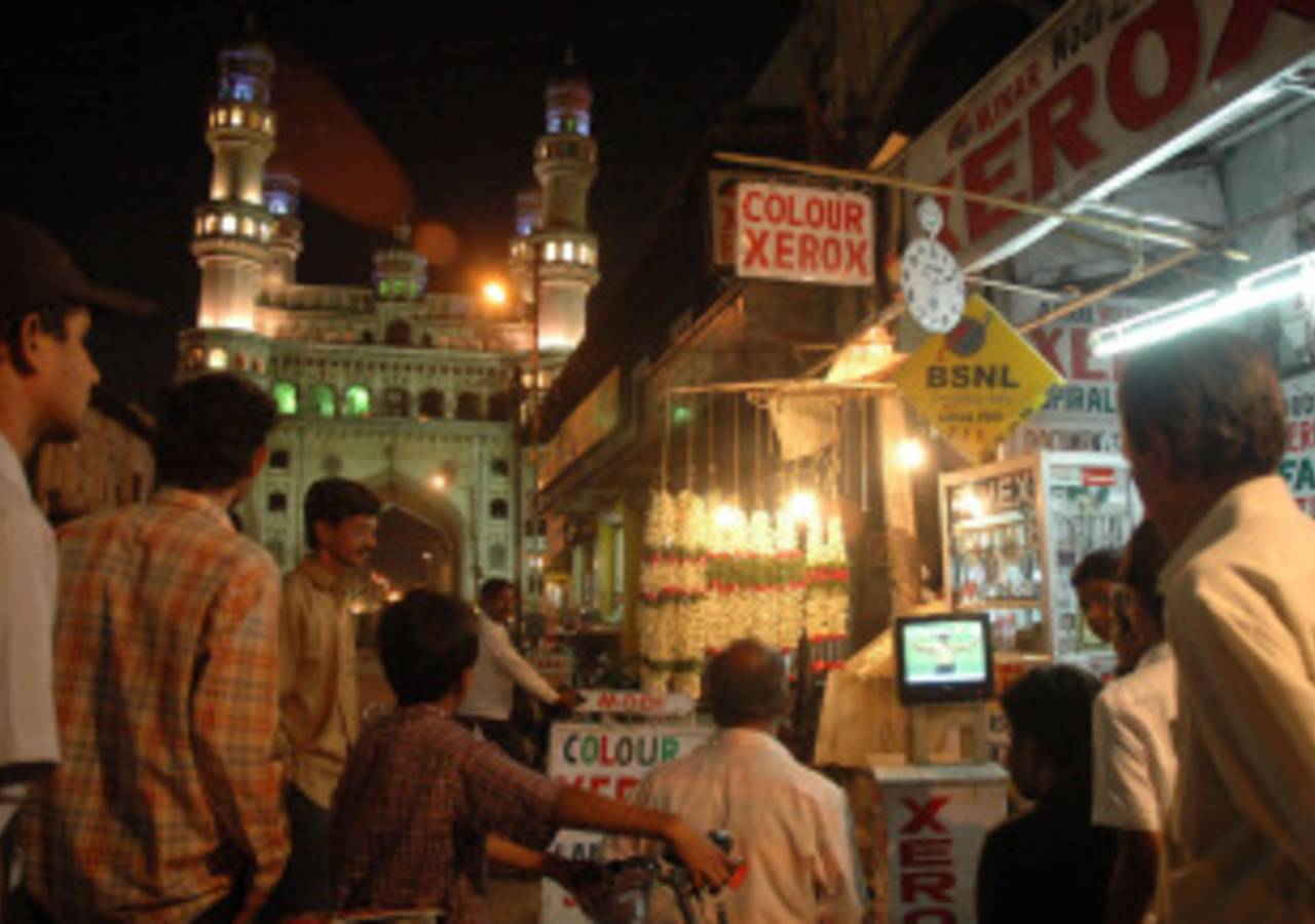 Indian fans watch a World Cup match outside a shop near the Charminar, Hyderabad, March 17, 2007