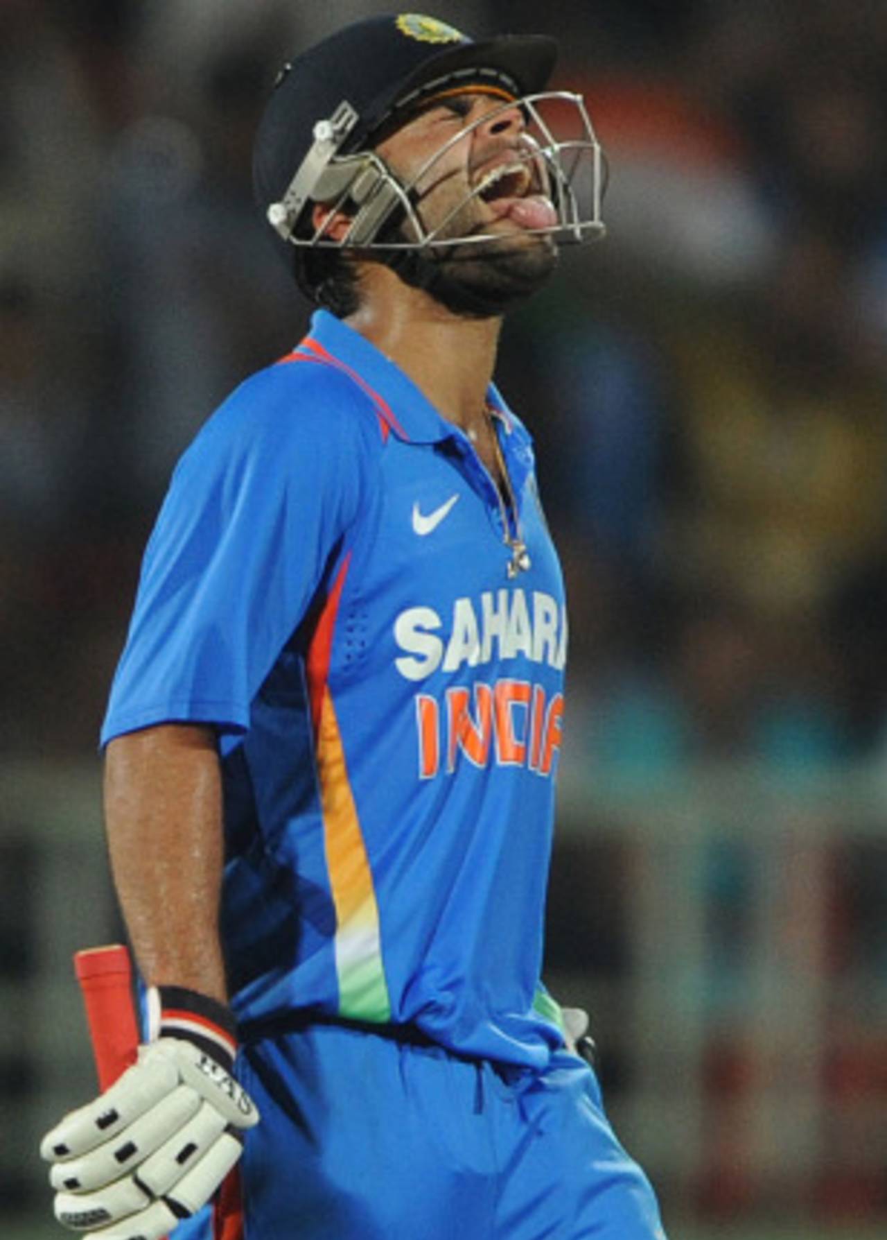 Virat Kohli grimaces in pain after he suffered cramps during India's chase, India v Australia, 2nd ODI, Visakhapatnam, October 20, 2010