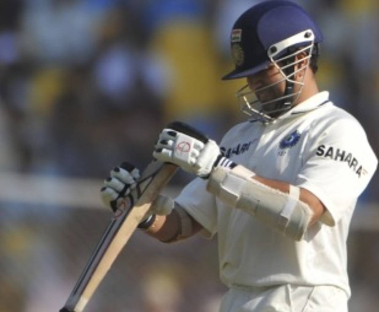 Sachin Tendulkar examines the bottom of his bat, India v New Zealand, 1st Test, Ahmedabad, 2nd day, November 5, 2010
