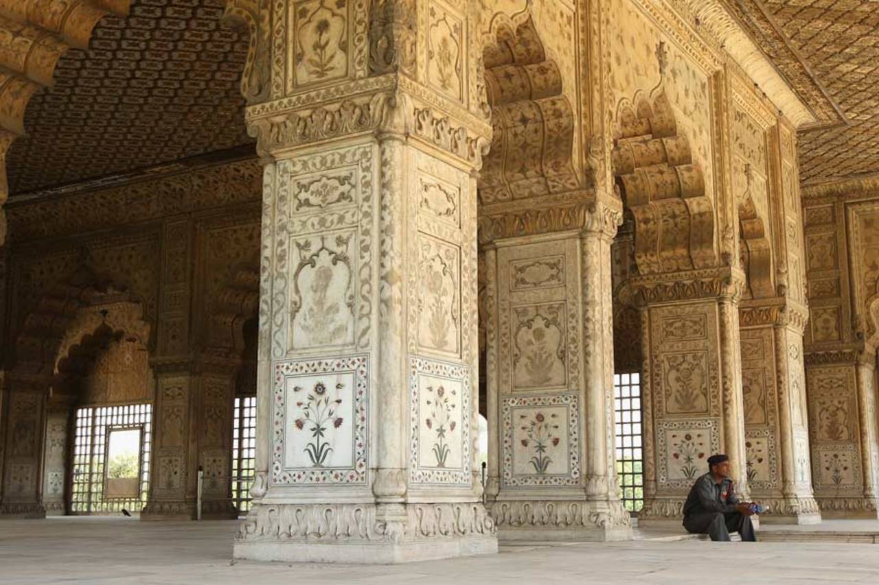 A guard sits inside the Red Fort, Old Delhi, September 30, 2010