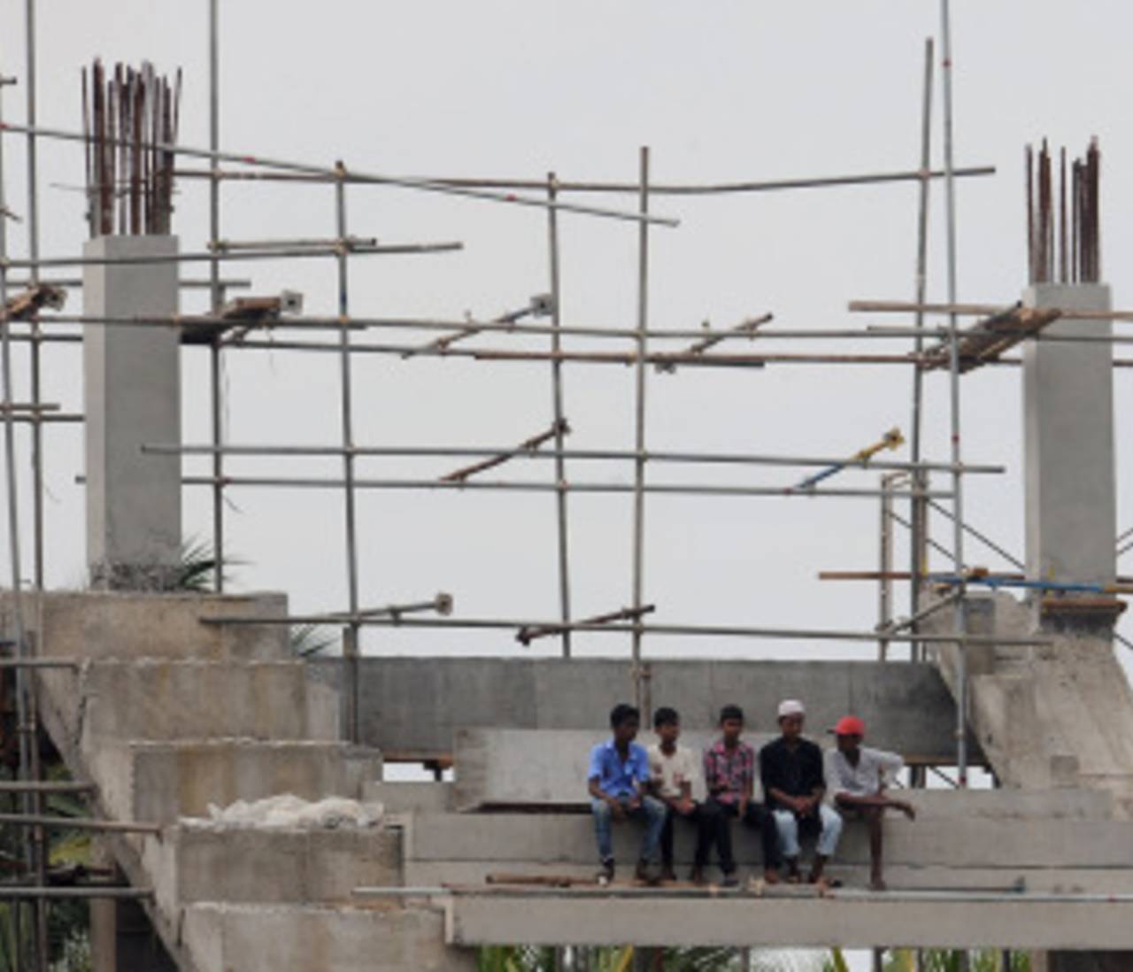 Fans sit in the unfinished stands at the Premadasa Stadium, Sri Lanka v West Indies, 2nd Test, Premadasa Stadium, Colombo, 2nd day, November 24, 2010