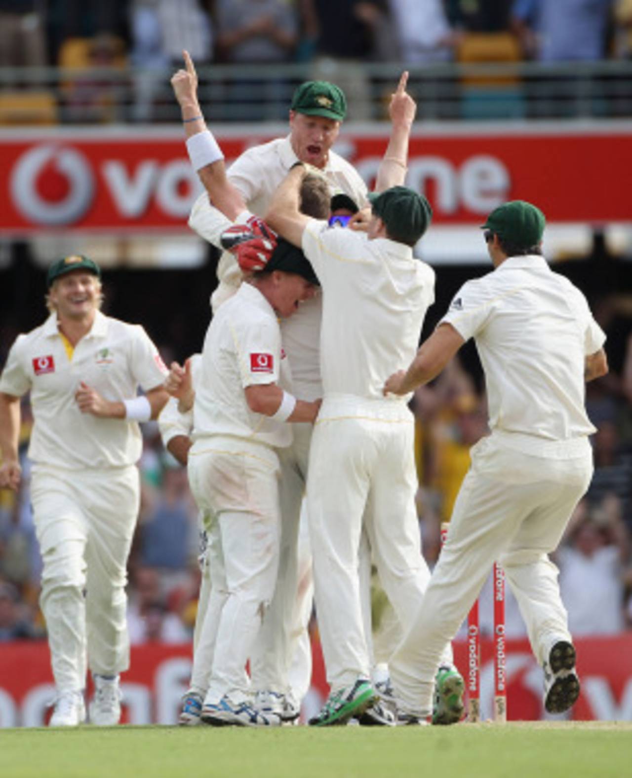 Peter Siddle is mobbed after claiming an Ashes hat-trick, Australia v England, 1st Test, Brisbane, 1st day, November 25, 2010
