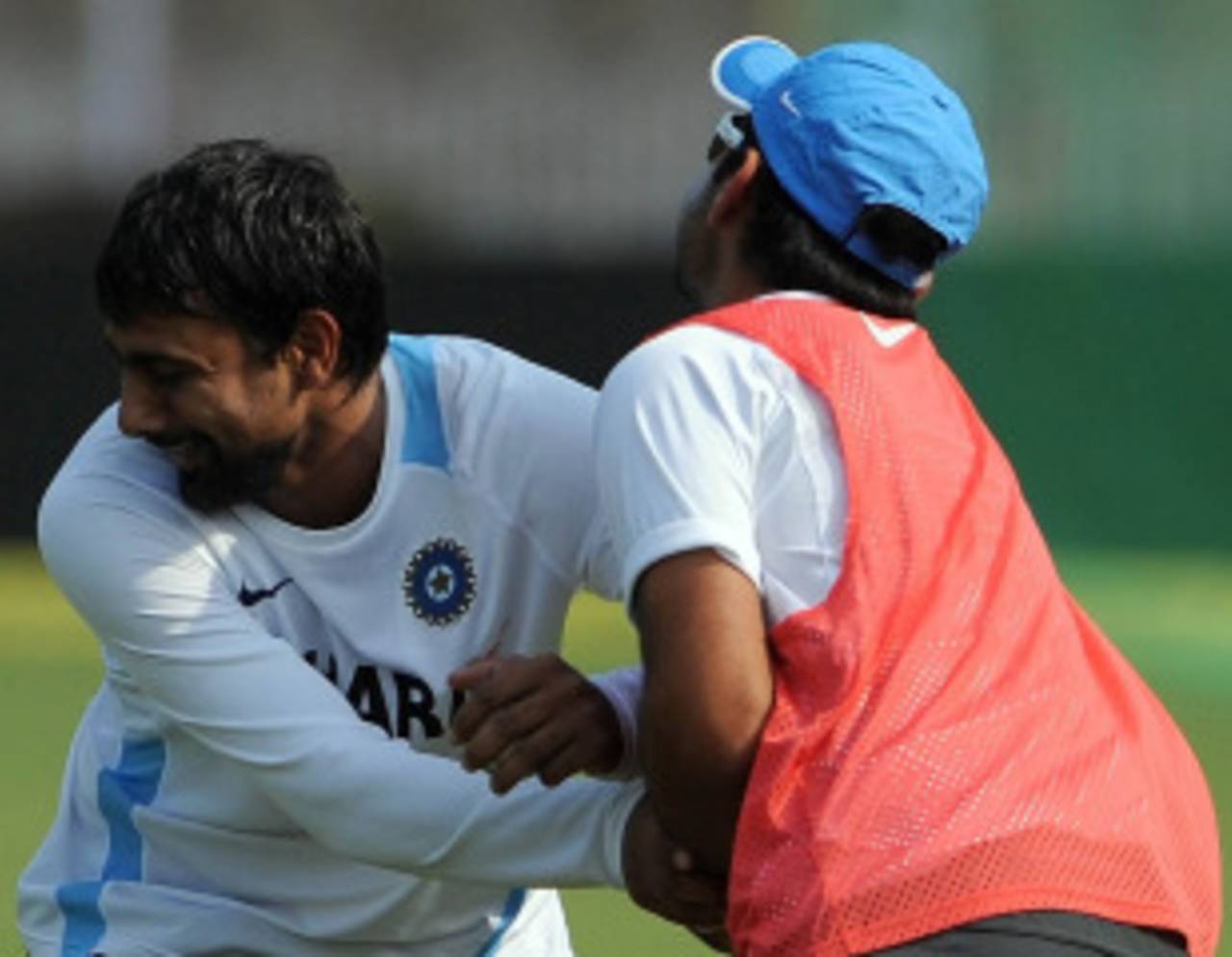 Praveen Kumar and Virat Kohli tussle in jest during a training session ahead of the third ODI against New Zealand, Vadodara, December 3, 2010