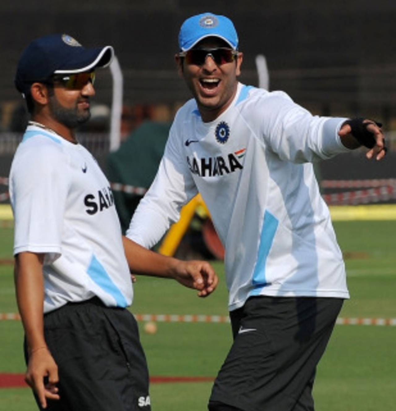Gautam Gambhir and Yuvraj Singh share a joke, in training, Vadodara, December 3, 2010