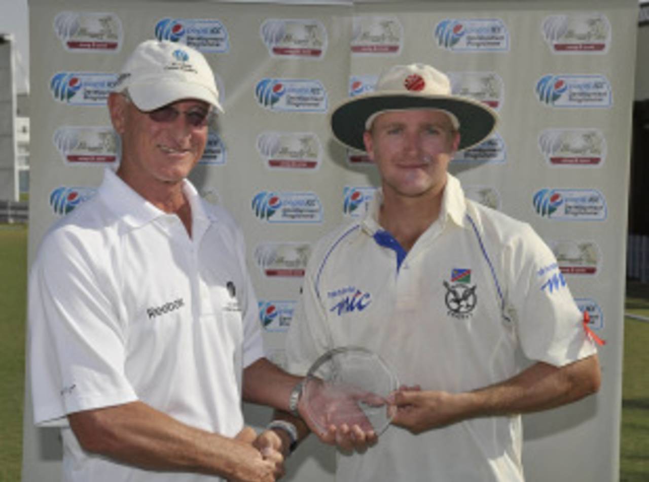 Craig Williams collects his Man-of-the-Match award from Dayle Hadlee, UAE v Namibia, ICC Intercontinental Shield final, Dubai, December 5, 2010
