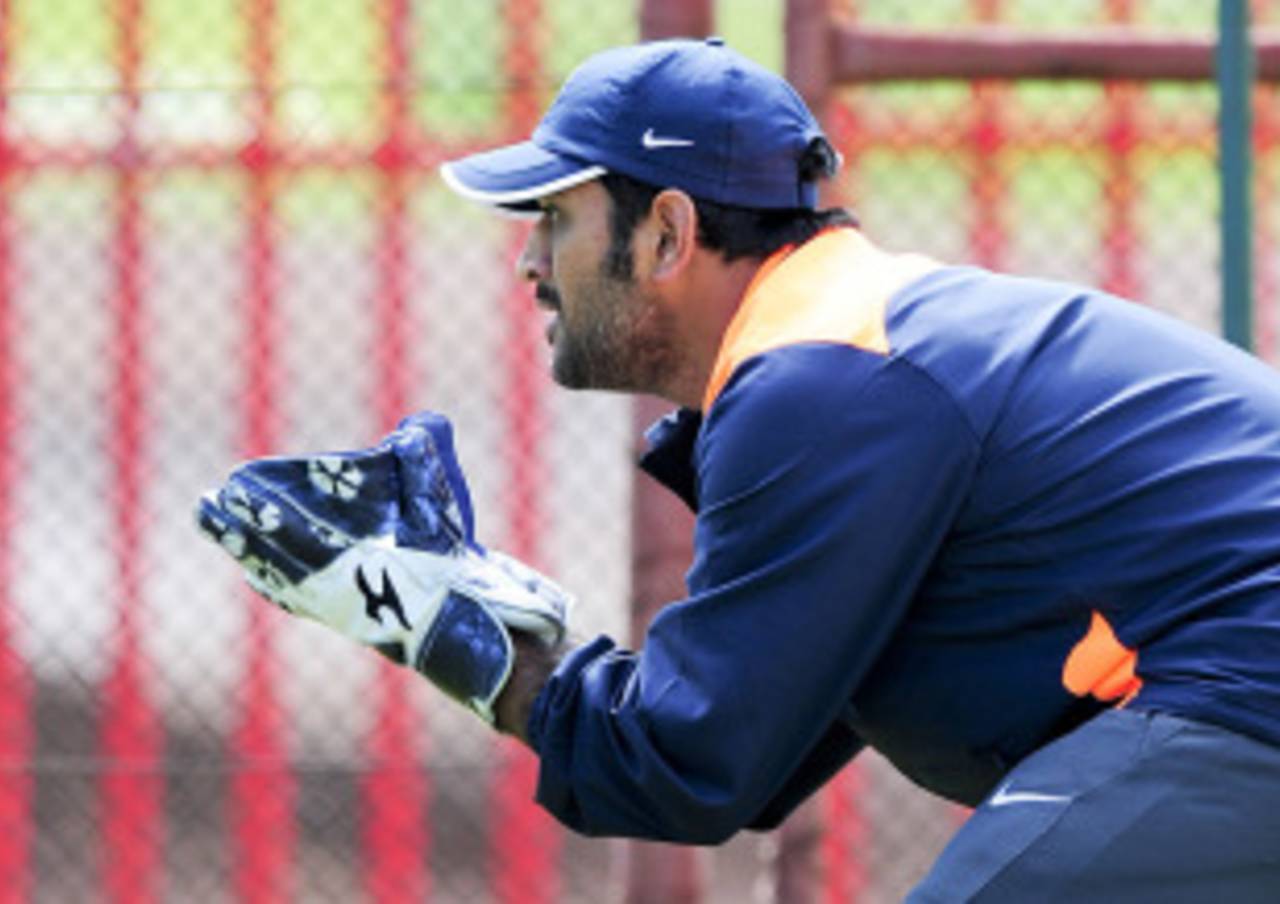 MS Dhoni gets in some wicketkeeping practice in the nets, Centurion, December 13, 2010