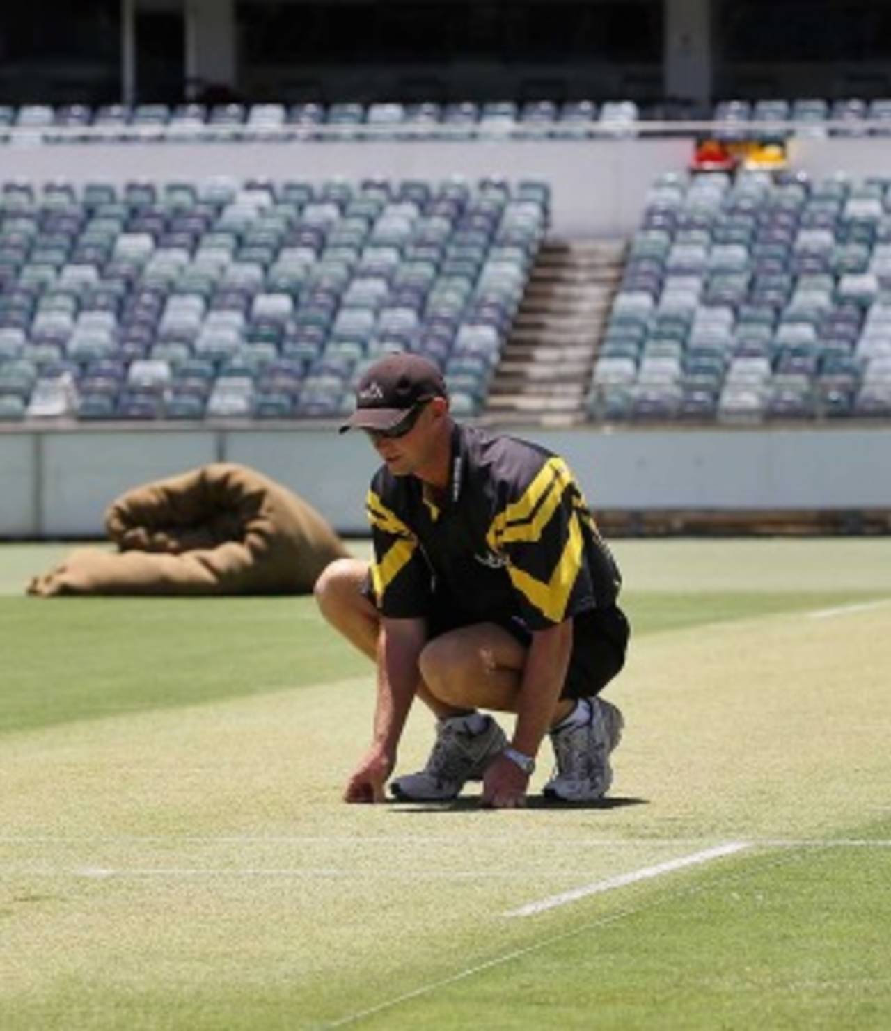 Cameron Sutherland, the WACA curator, inspects his Test pitch, Perth, December 14, 2010