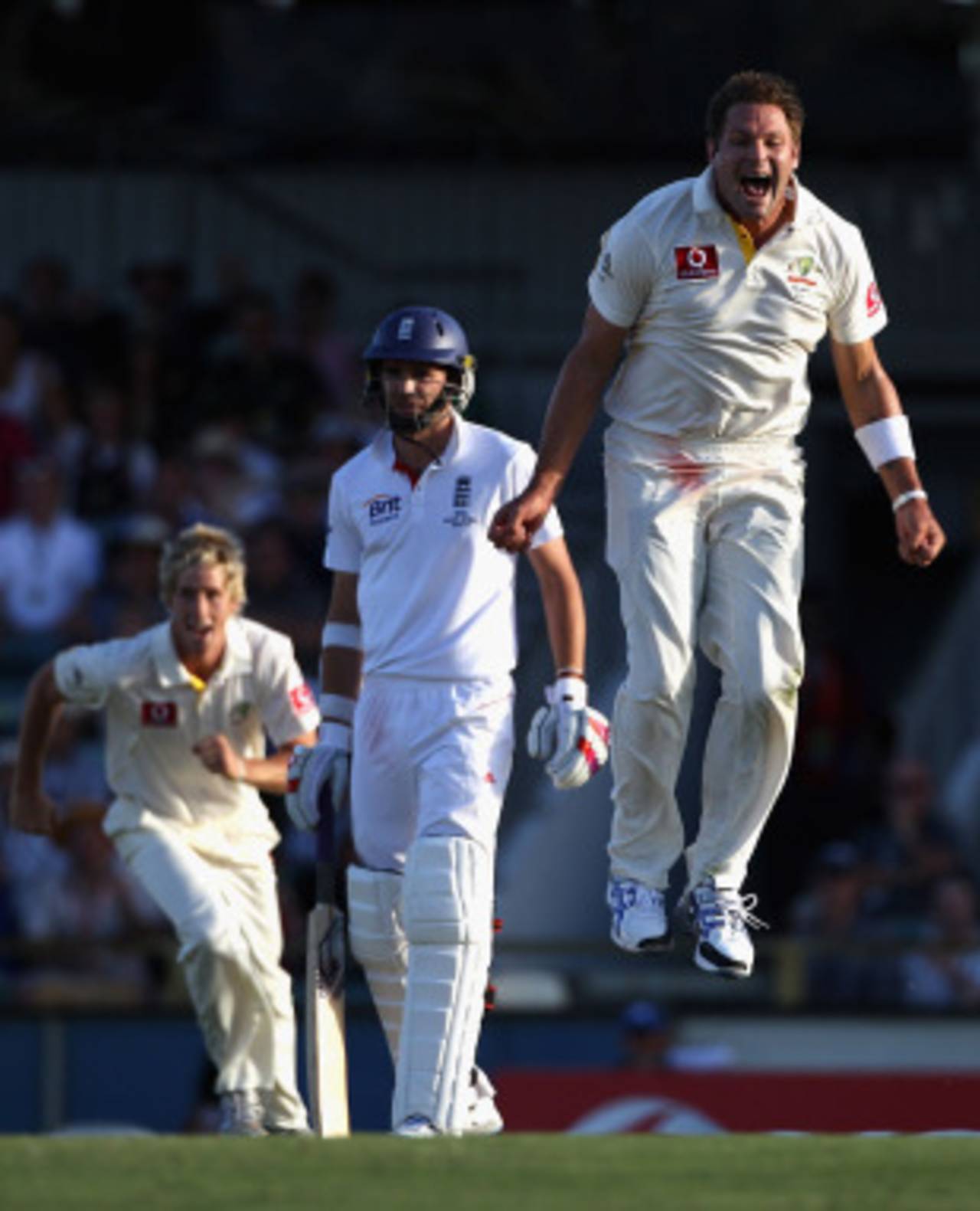 Ryan Harris leaps for joy as James Anderson looks on at Paul Collingwood's dismissal, Australia v England, 3rd Test, Perth, 3rd day, December 18, 2010