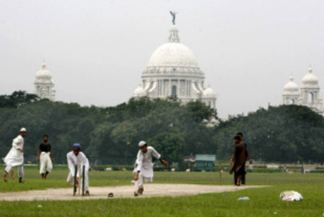 Students of a local madrassa play cricket on the Maidan, the largest open park in Kokata, July 18, 2008