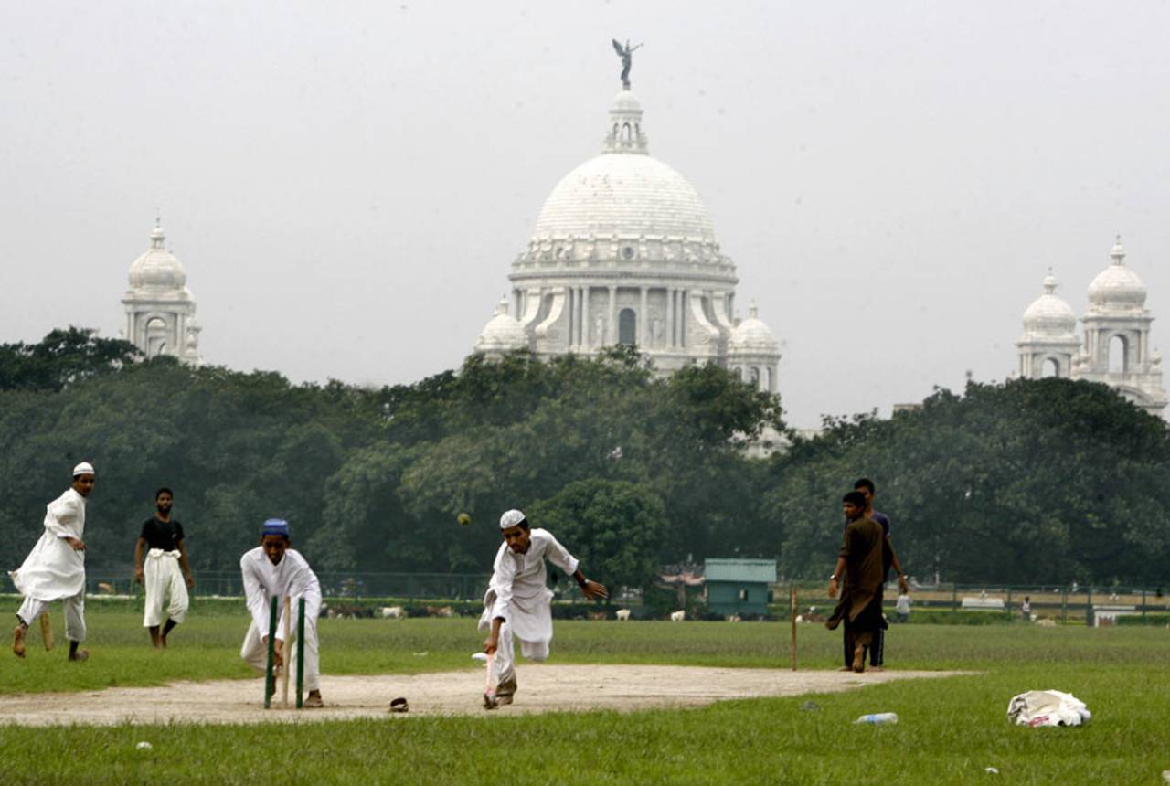 Students of a local madrassa play cricket on the Maidan, the largest open park in Kokata, July 18, 2008