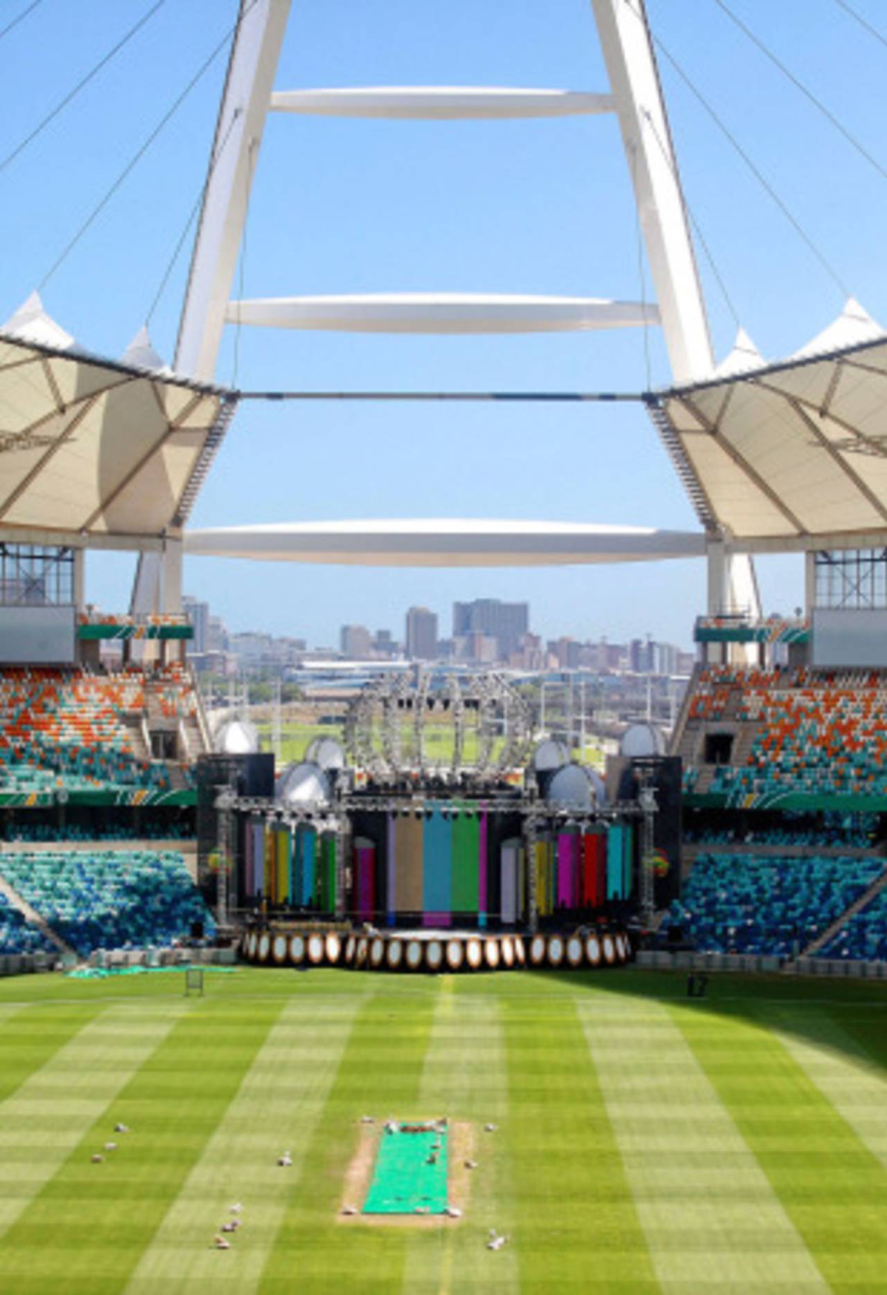 Workers prepare a cricket pitch and a massive multi-million dollar makeshift stage at the Moses Mabhida football stadium, Durban, January 7, 2011