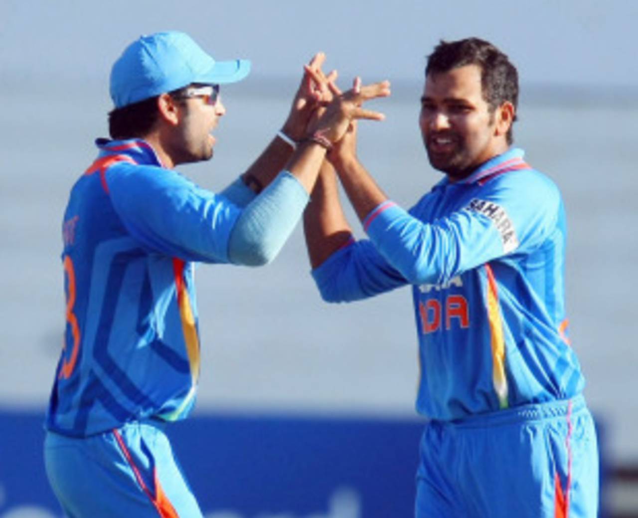 Rohit Sharma and M Vijay celebrate the wicket of AB de Villiers, South Africa v India, 1st ODI, Durban, January 12, 2011