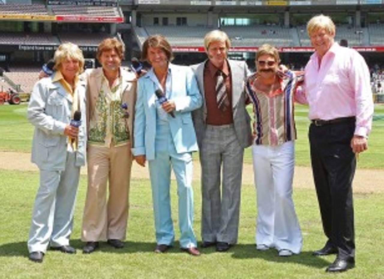 Greig (far right) and Nicholas (third from left) in retro outfits along with their Channel 9 colleagues&nbsp;&nbsp;&bull;&nbsp;&nbsp;Getty Images
