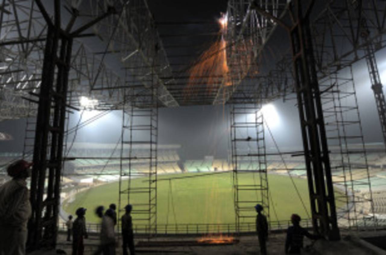 Workers weld the roof of Eden Gardens, Kolkata, January 27, 2011