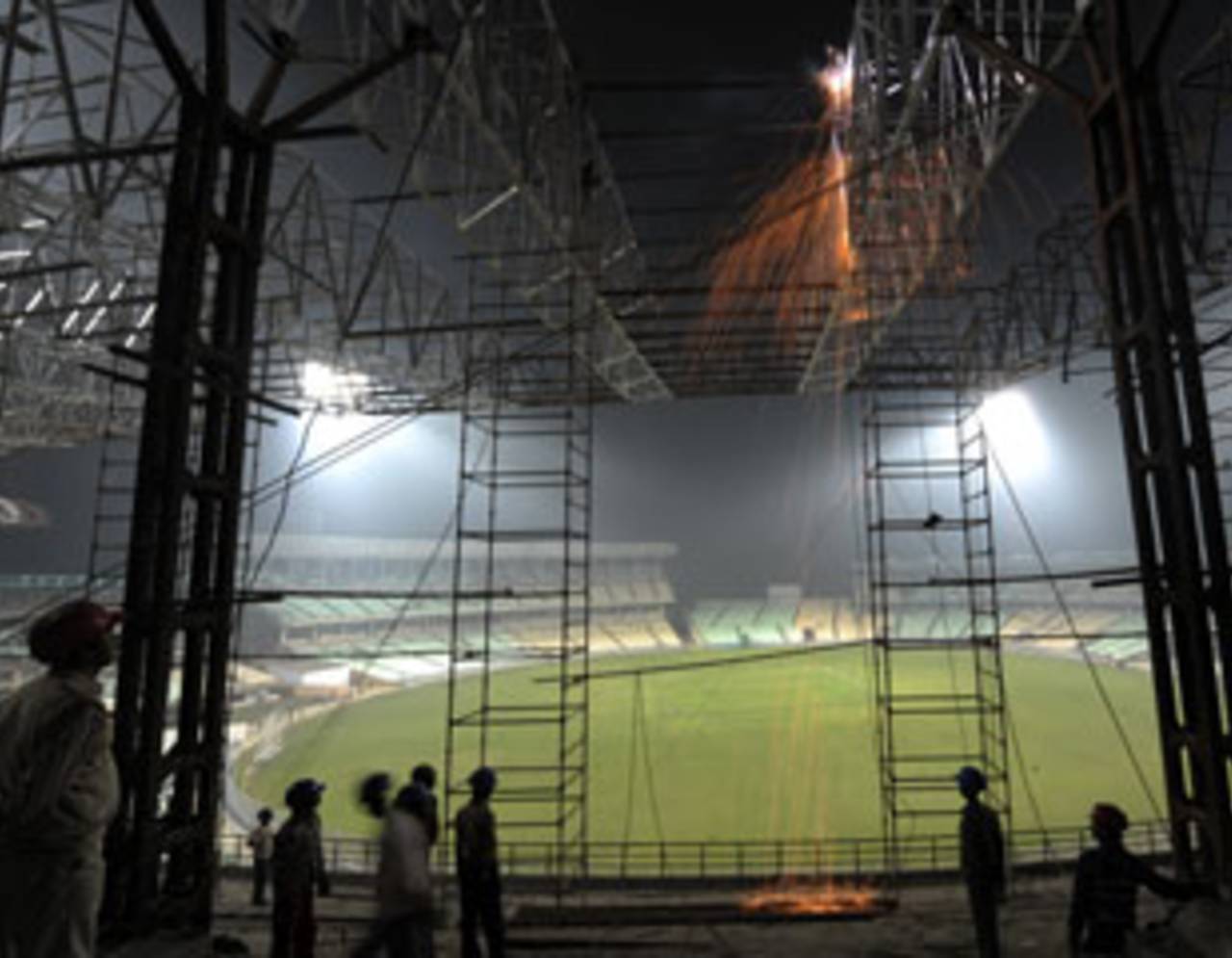 Workers weld the roof of Eden Gardens, Kolkata, January 27, 2011