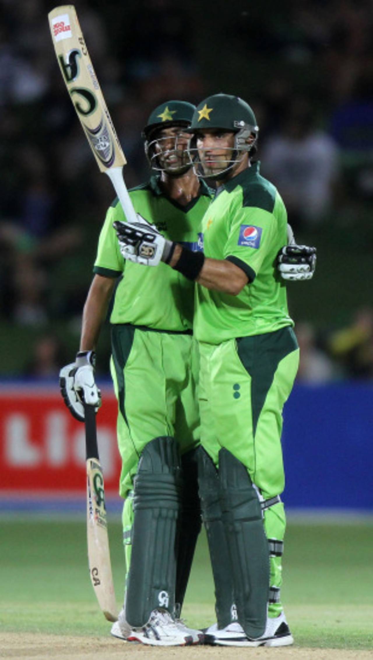 Misbah-ul-Haq is congratulated by Younis Khan on reaching his half-century, New Zealand v Pakistan, 4th ODI, Napier, February 1, 2011