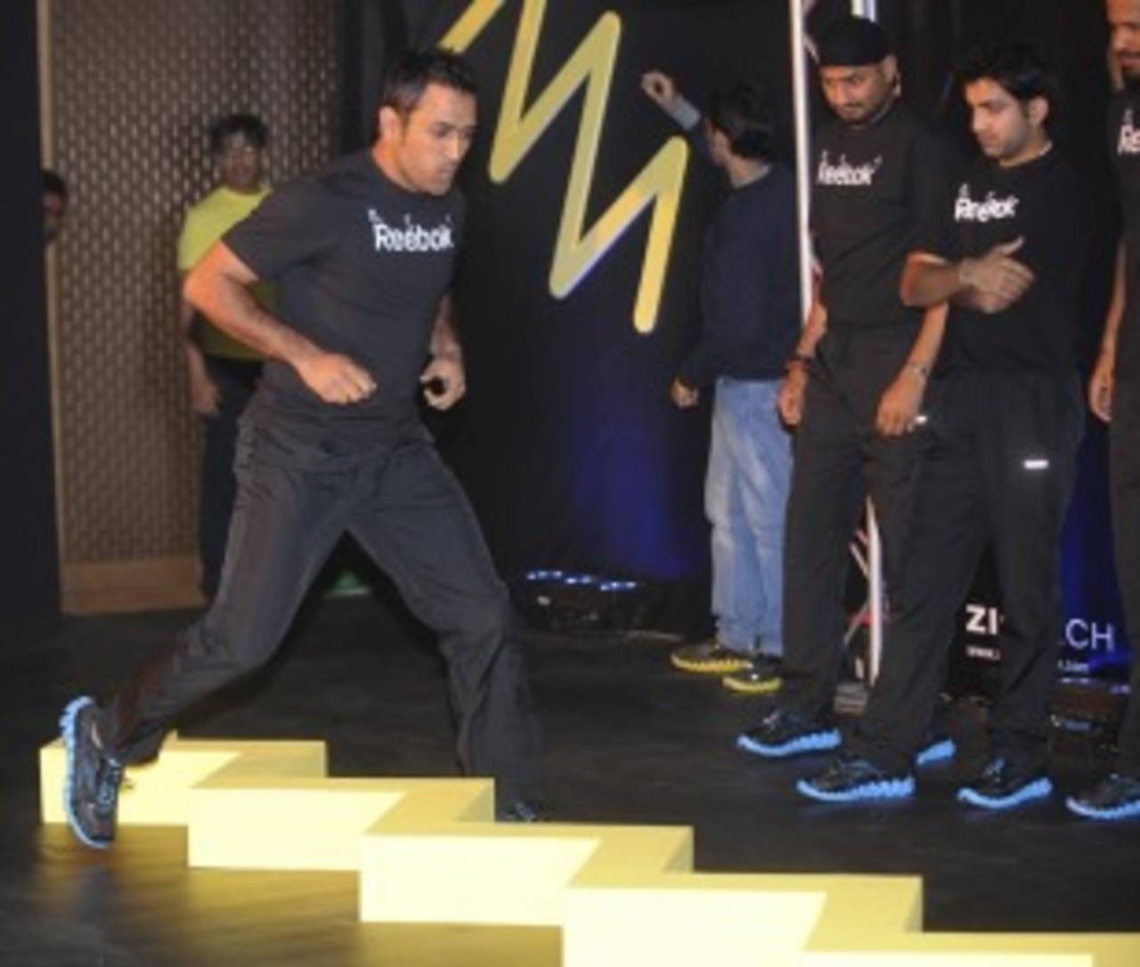 MS Dhoni performs an exercise at a promotional event, New Delhi, February 2, 2011