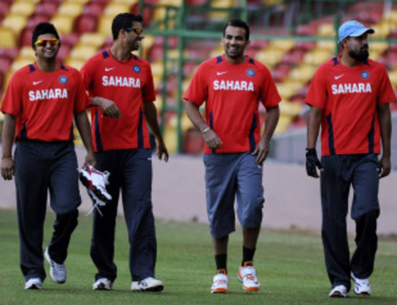 Suresh Raina, Ashish Nehra, Zaheer Khan and Yusuf Pathan share a joke during practice, Bangalore, February 9, 2011