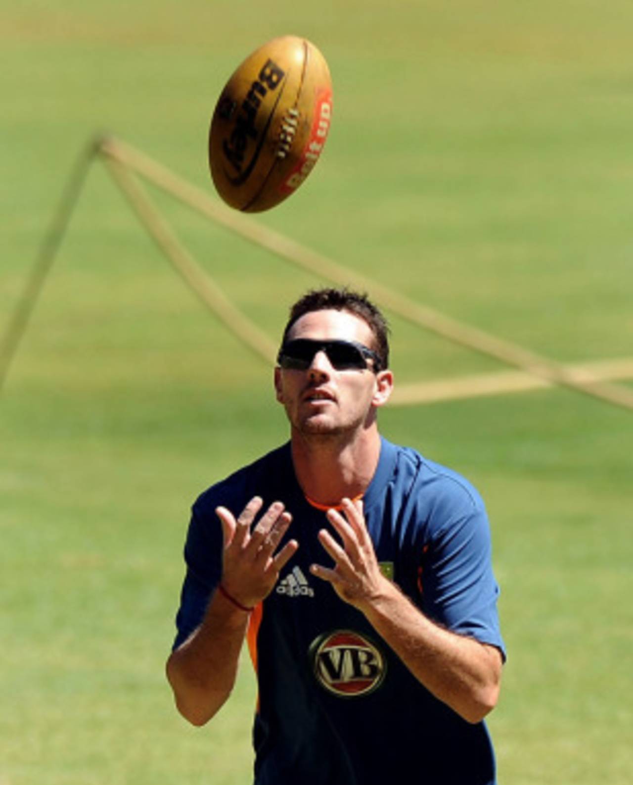 Shaun Tait catches a rugby ball at Australia's training session, Bangalore, February 11, 2011