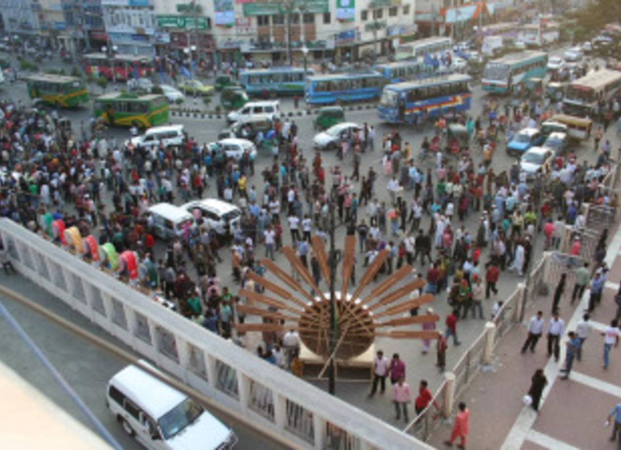 People crowd the area outside the Bangabandhu National Stadium the day before the opening ceremony, Dhaka, February 16, 2011