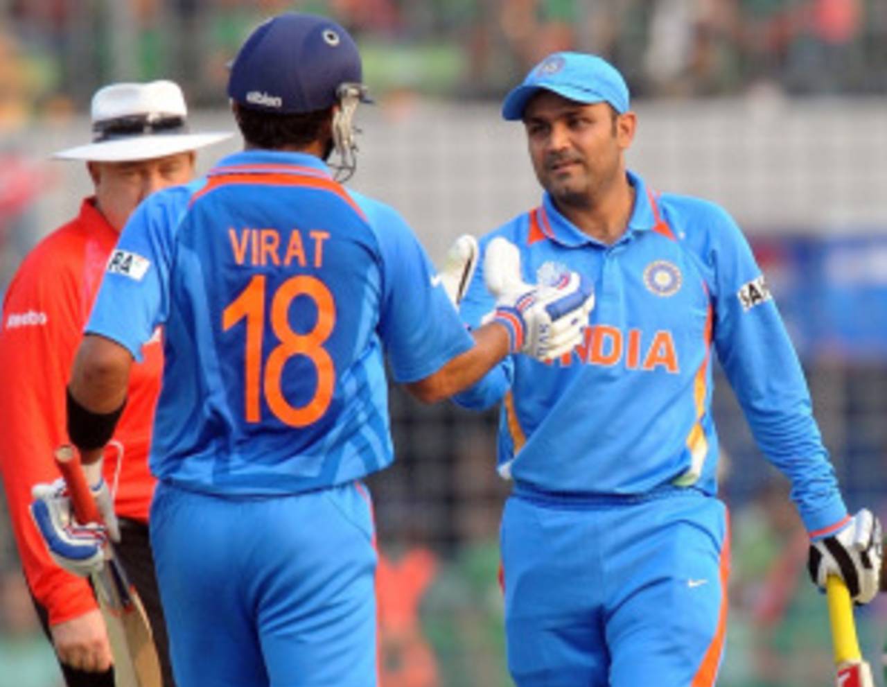 Virender Sehwag is congratulated by Virat Kohli after getting to a century off 94 balls, Bangladesh v India, Group B, World Cup 2011, Mirpur, February 19, 2011