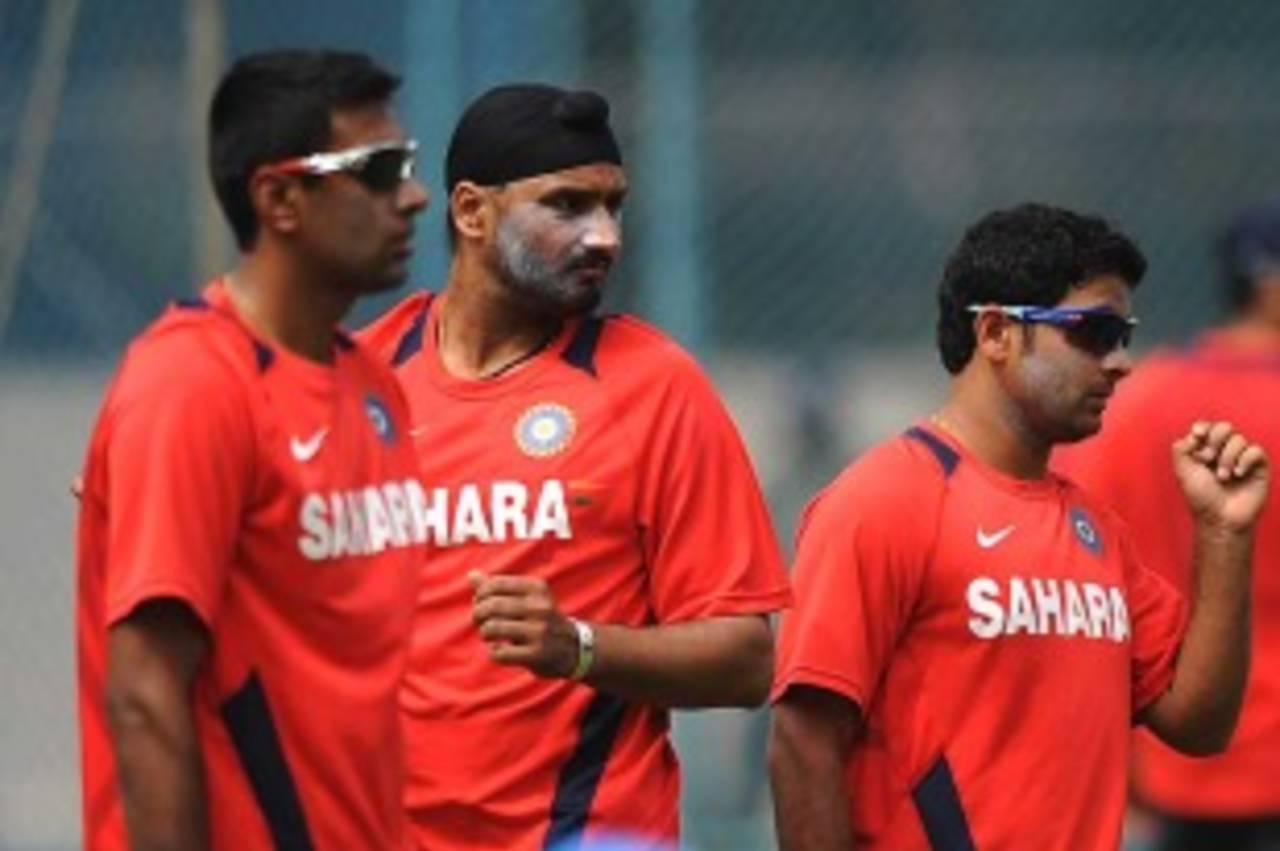 R Ashwin, Harbhajan Singh and Piyush Chawla prepare to bowl at the nets, Bangalore, February 25, 2011