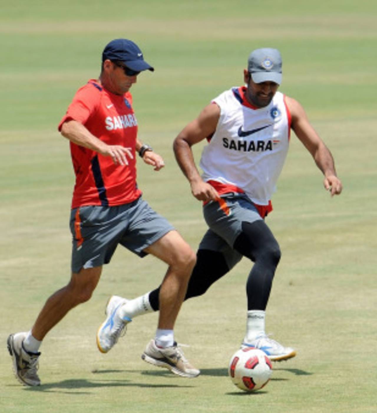 Gary Kirsten takes on MS Dhoni during a warm-up game of football, Chennai, March 18, 2011