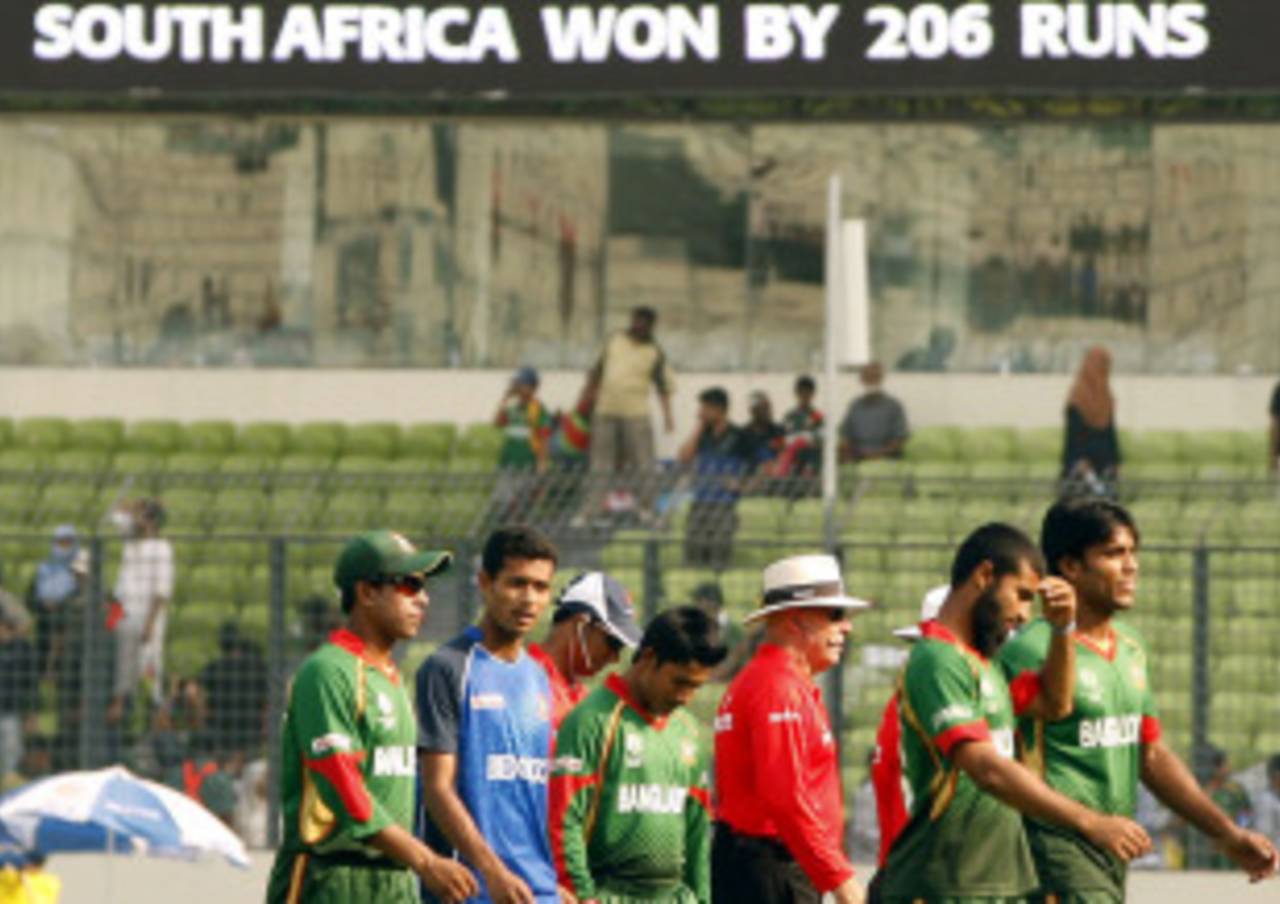 Bangladesh's players walk off dejected after being dumped out of the World Cup, Bangladesh v South Africa, Group B, World Cup 2011, March 19, 2011