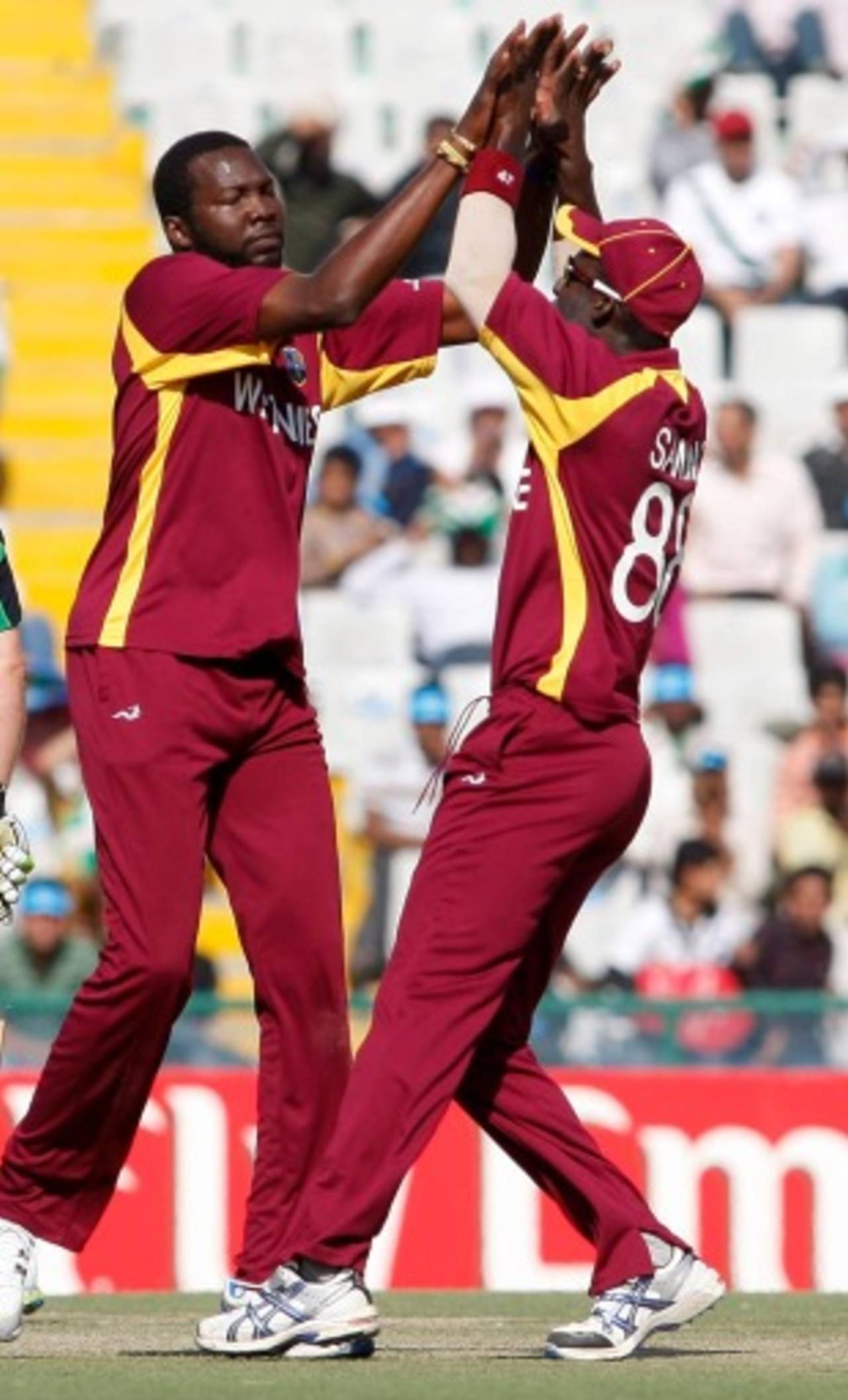 Sulieman Benn and Darren Sammy celebrate, Ireland v West Indies, Group B, World Cup, Mohali, March 11, 2011