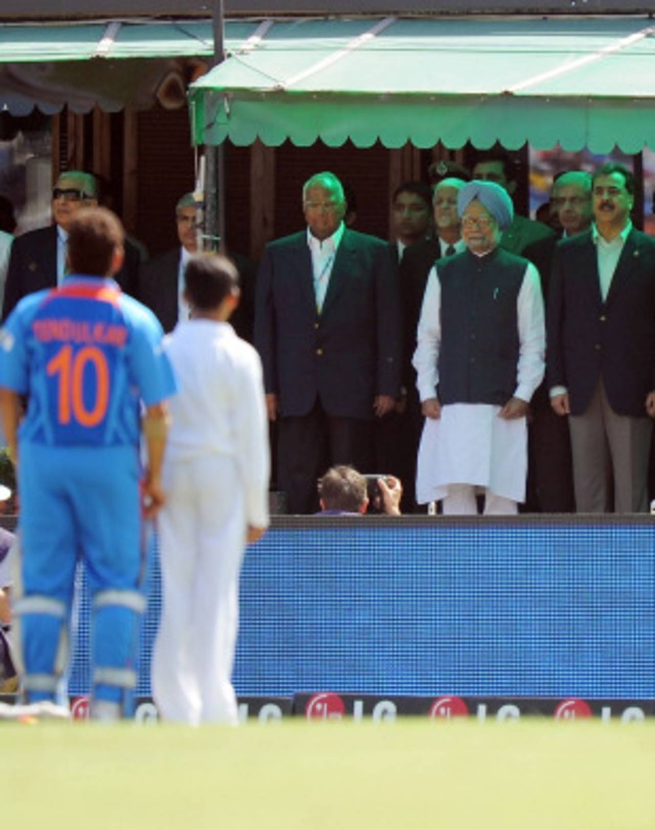 India PM Manmohan Singh and Pakistan PM Yousuf Raza Gilani stand for the national anthems prior to the match, India v Pakistan, 2nd semi-final, World Cup 2011, Mohali, March 30, 2011