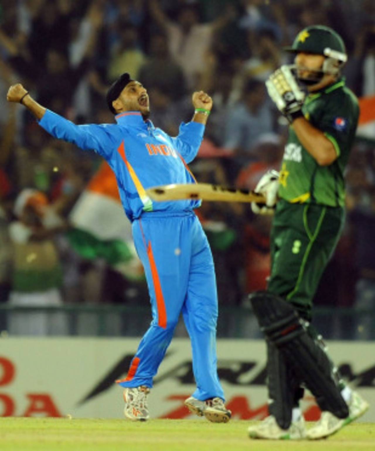 Contrasting emotions from Shahid Afridi and Harbhajan Singh after the former's dismissal, India v Pakistan, 2nd semi-final, World Cup 2011, Mohali, March 30, 2011