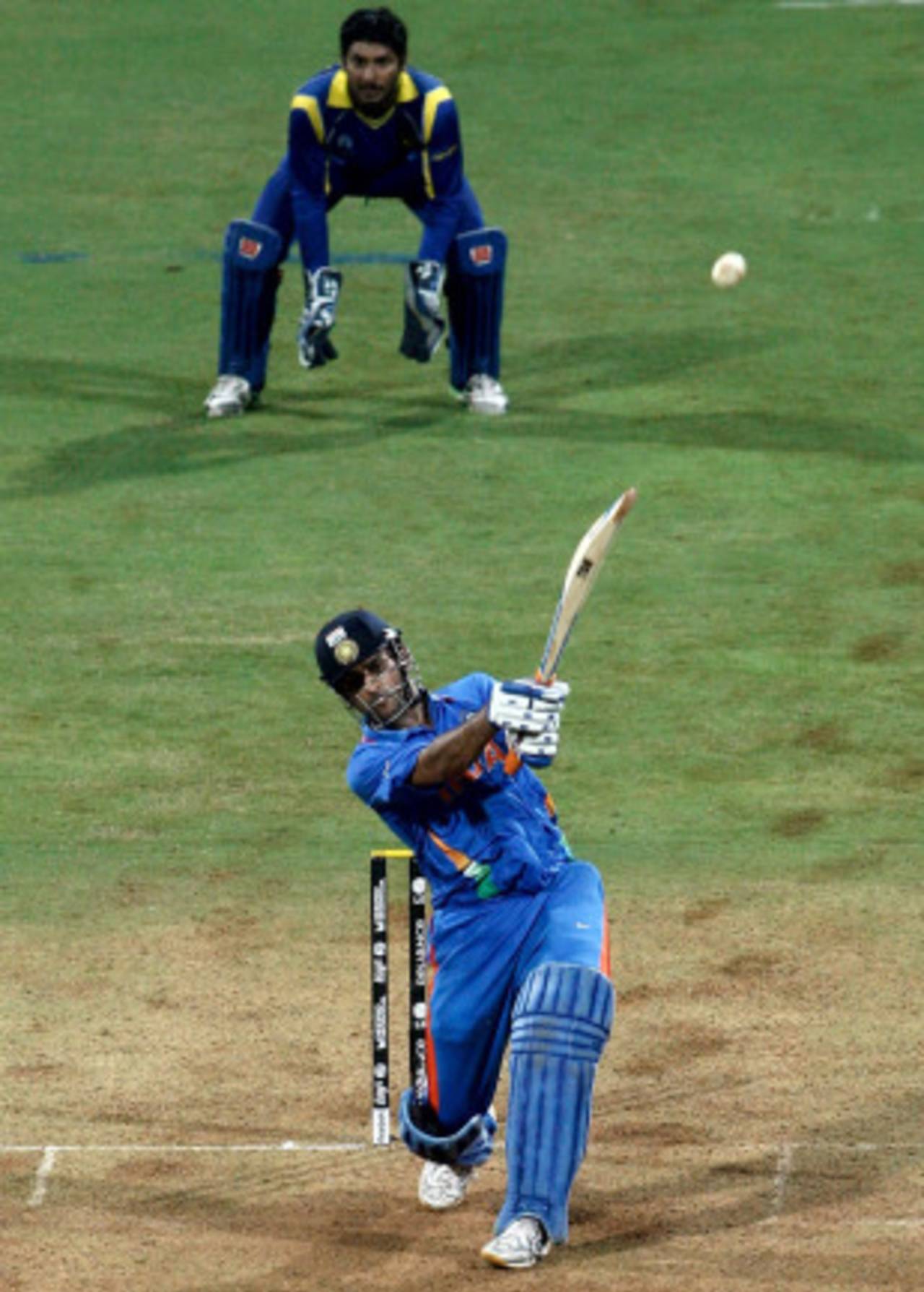 Disappointment and contentment. MS Dhoni and Kumar Sangakkara see the winning hit sail out of the ground, India v Sri Lanka, final, World Cup 2011, Mumbai, April 2, 2011