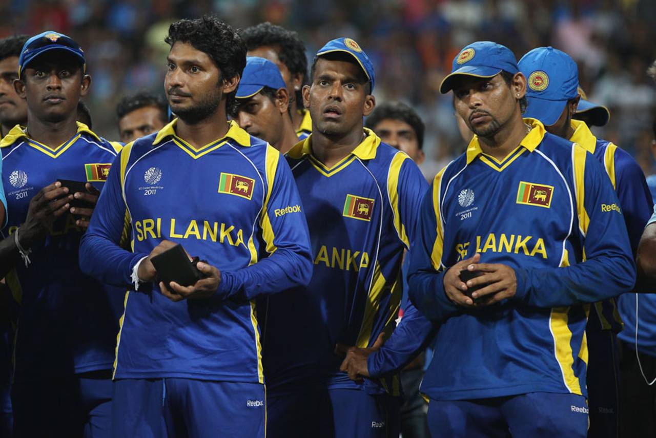 Disappointed Sri Lanka players watch their opponents life the trophy, India v Sri Lanka, final, World Cup 2011, Mumbai, April 2, 2011