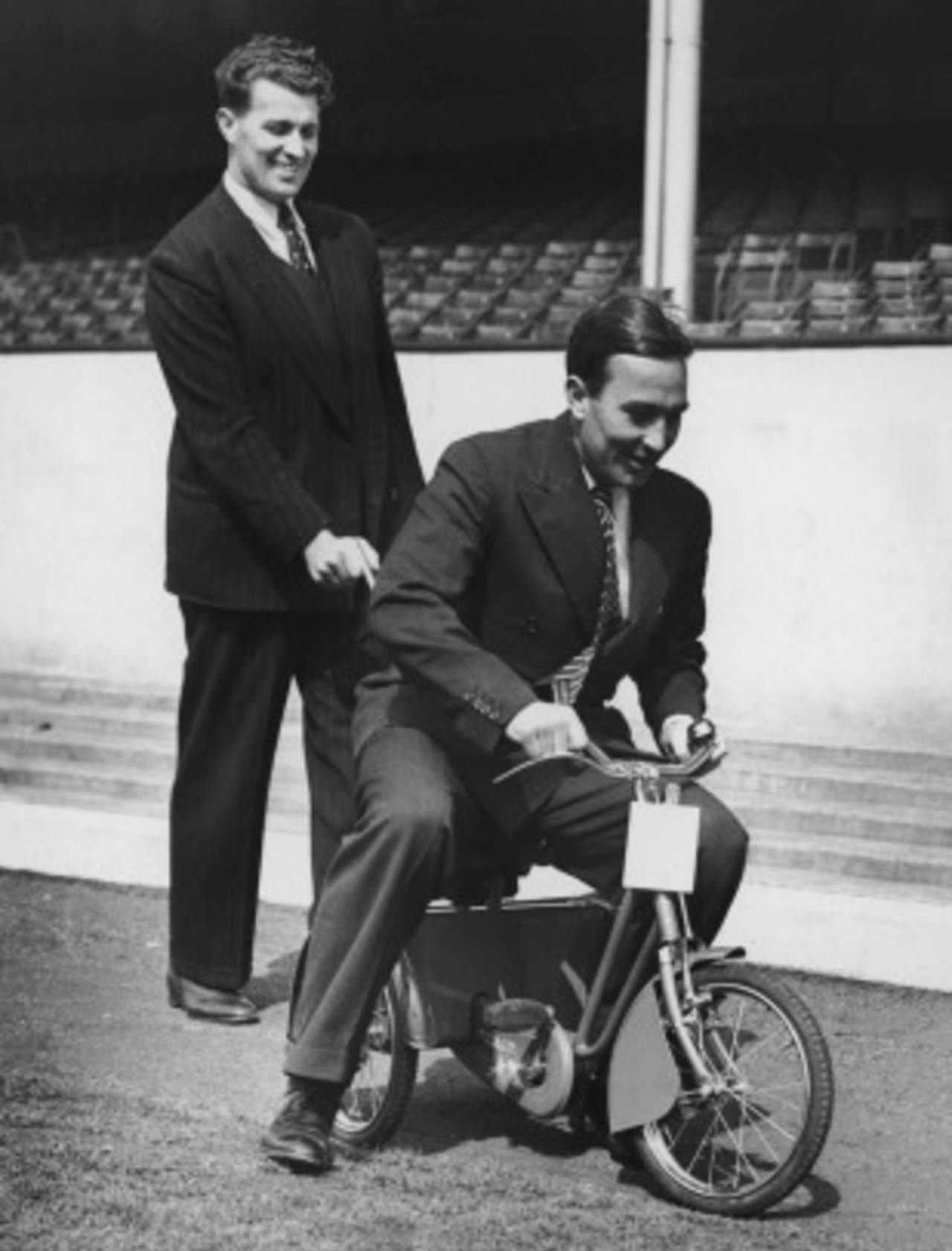 The Compton brothers, Leslie and Denis (on the tricycle), at Highbury, London, April 28, 1950
