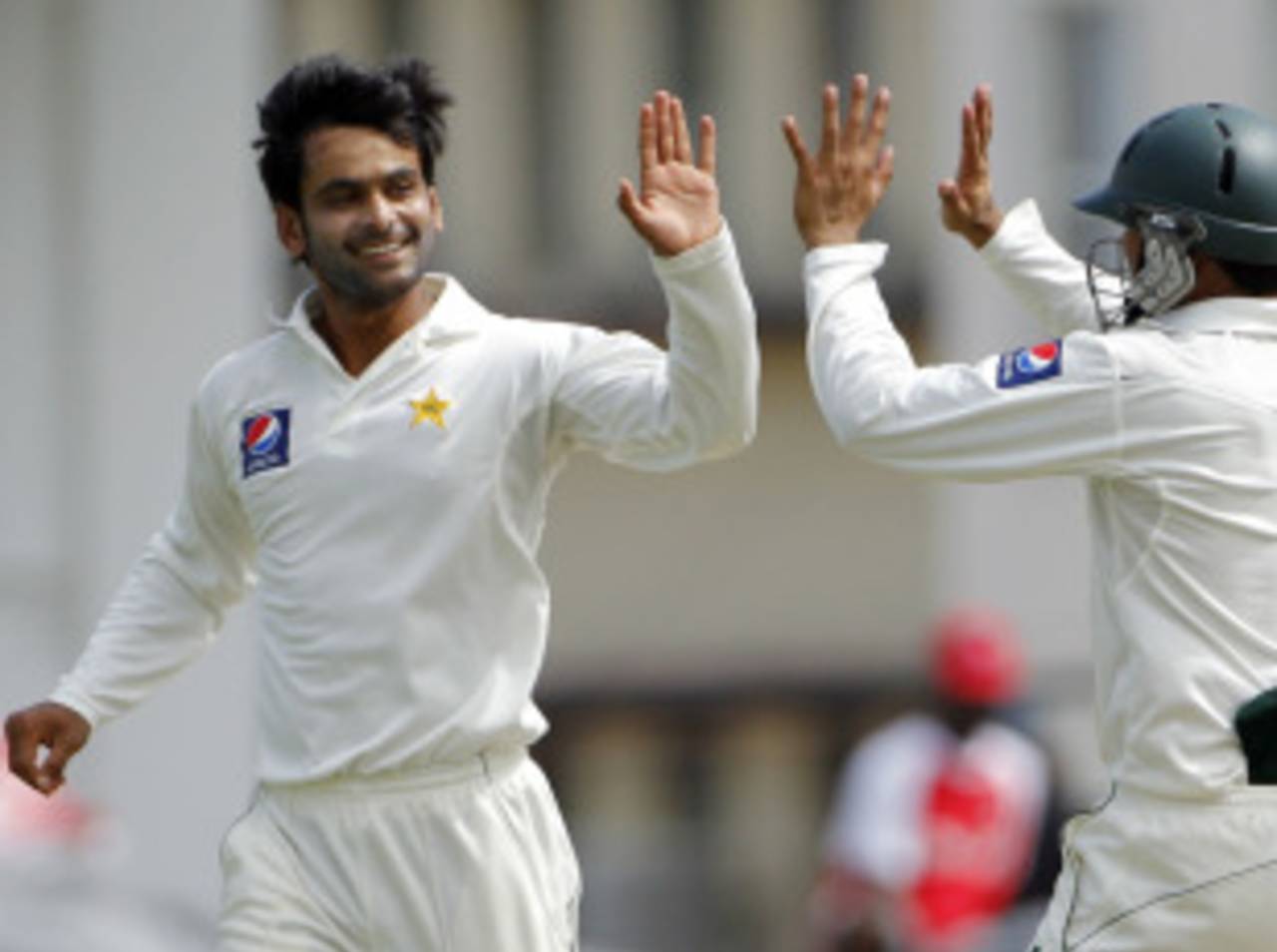 Mohammad Hafeez high-fives his team-mates after dismissing Darren Bravo, West Indies v Pakistan, 2nd Test, St Kitts, 2nd day, May 21, 2011