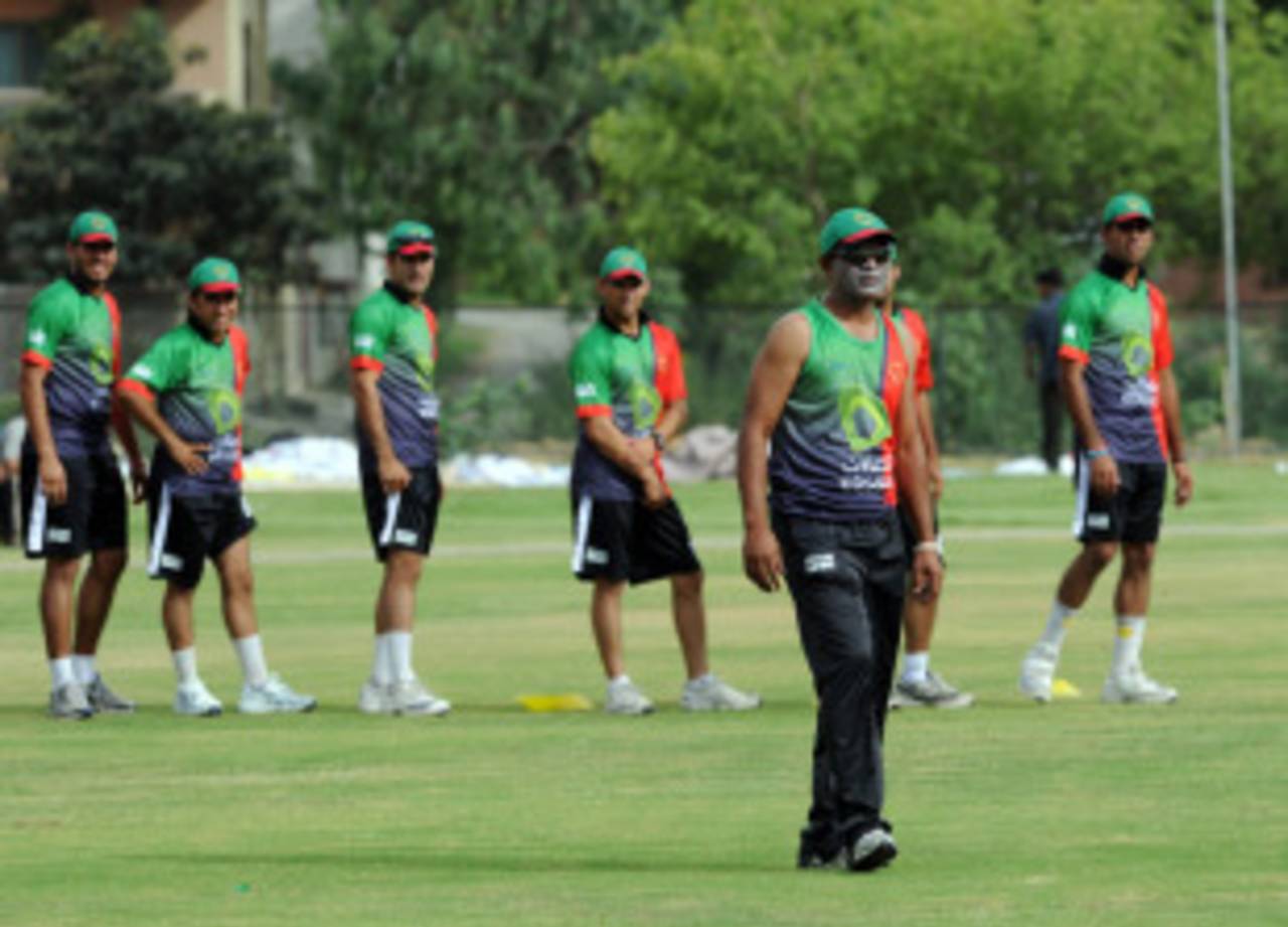 Afghanistan coach Rashid Latif supervises a training session at a local cricket stadium in Islamabad, May 28, 2011