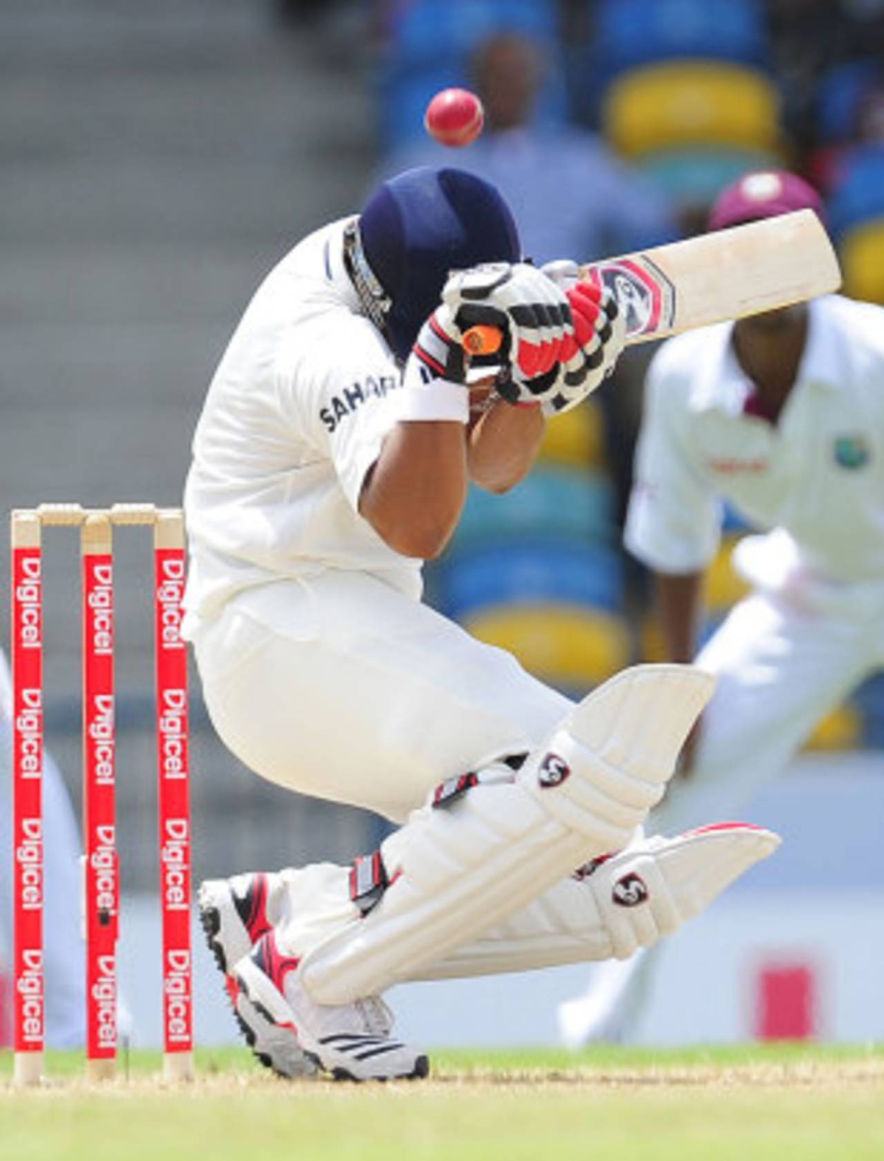 Suresh Raina is hit on the helmet by a Ravi Rampaul bouncer, West Indies v India, 2nd Test, Bridgetown, 1st day, June 28, 2011 