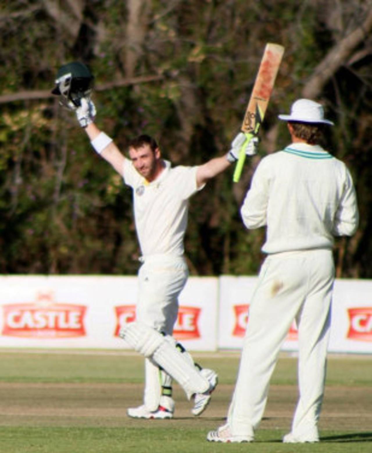 Phillip Hughes acknowledges the spectators' applause after reaching a ton, Zimbabwe XI v Australia, Harare, 2nd day, July 16 2011