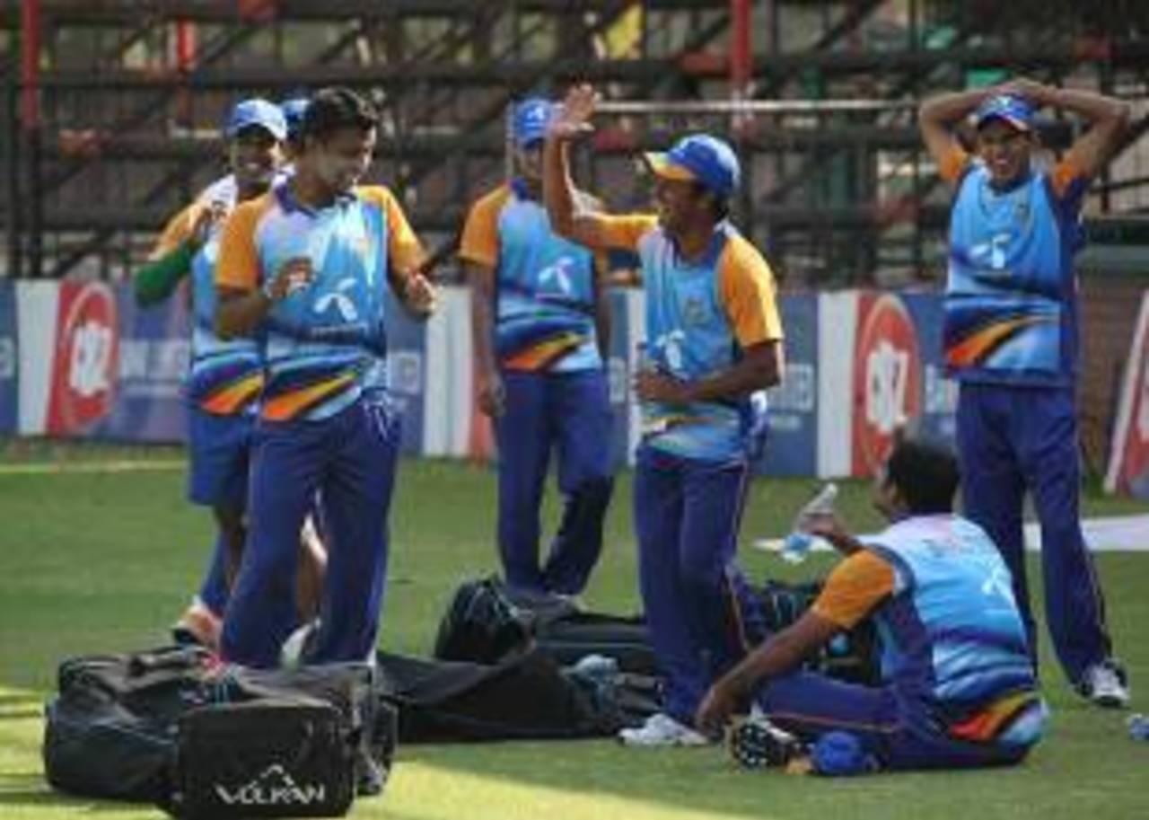 Mohammad Ashraful shares a joke with his team-mates at a practice session, Harare, July 29, 2011