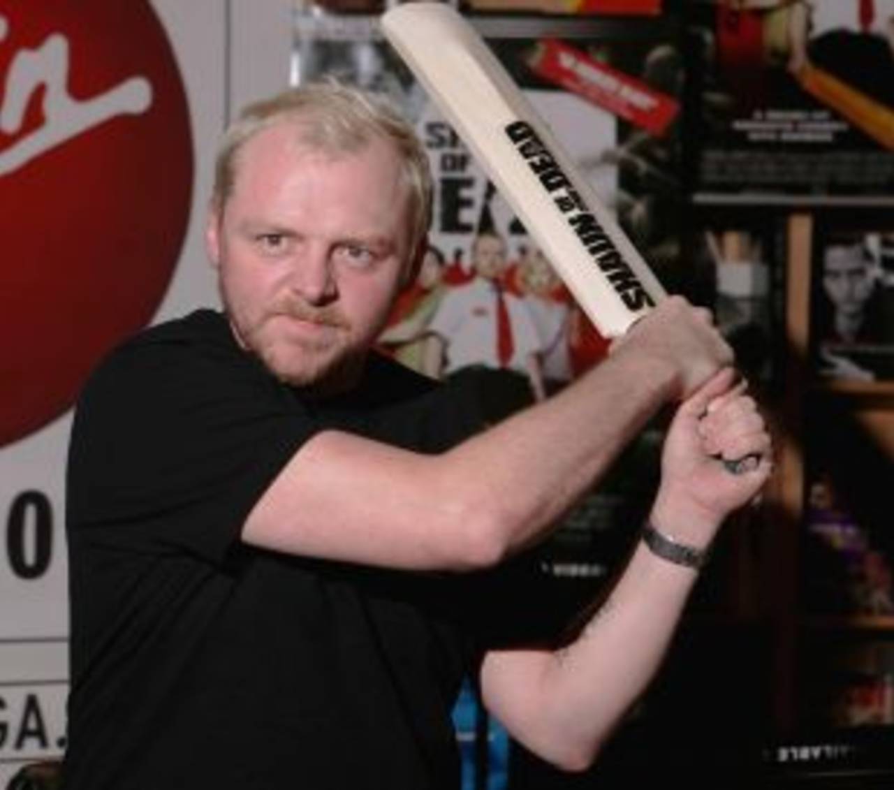 Actor Simon Pegg wields a cricket bat at an event for <i>Shaun of the dead</i>, January 6, 2005