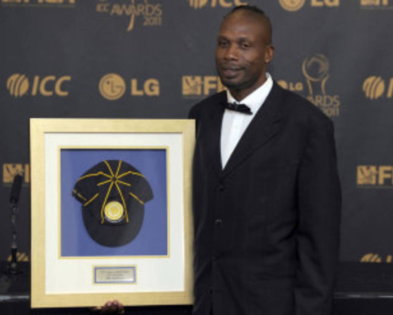 Curtly Ambrose sports his memento after being inducted into the ICC Hall of Fame, ICC Awards, London, September 12, 2011