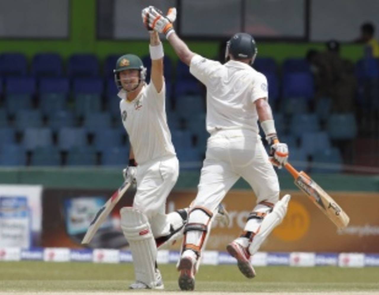 Michael Hussey high fives Michael Clarke, who brought up his century, Sri Lanka v Australia, 3rd Test, Colombo, 5th day, September 20, 2011