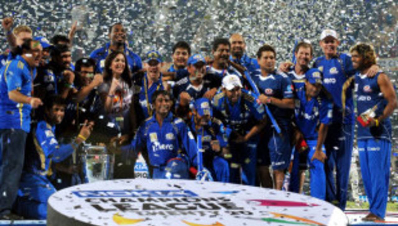 The Mumbai Indians team pose with the CLT20 trophy, Mumbai Indians v RCB, CLT20 final, Chennai, October 9, 2011