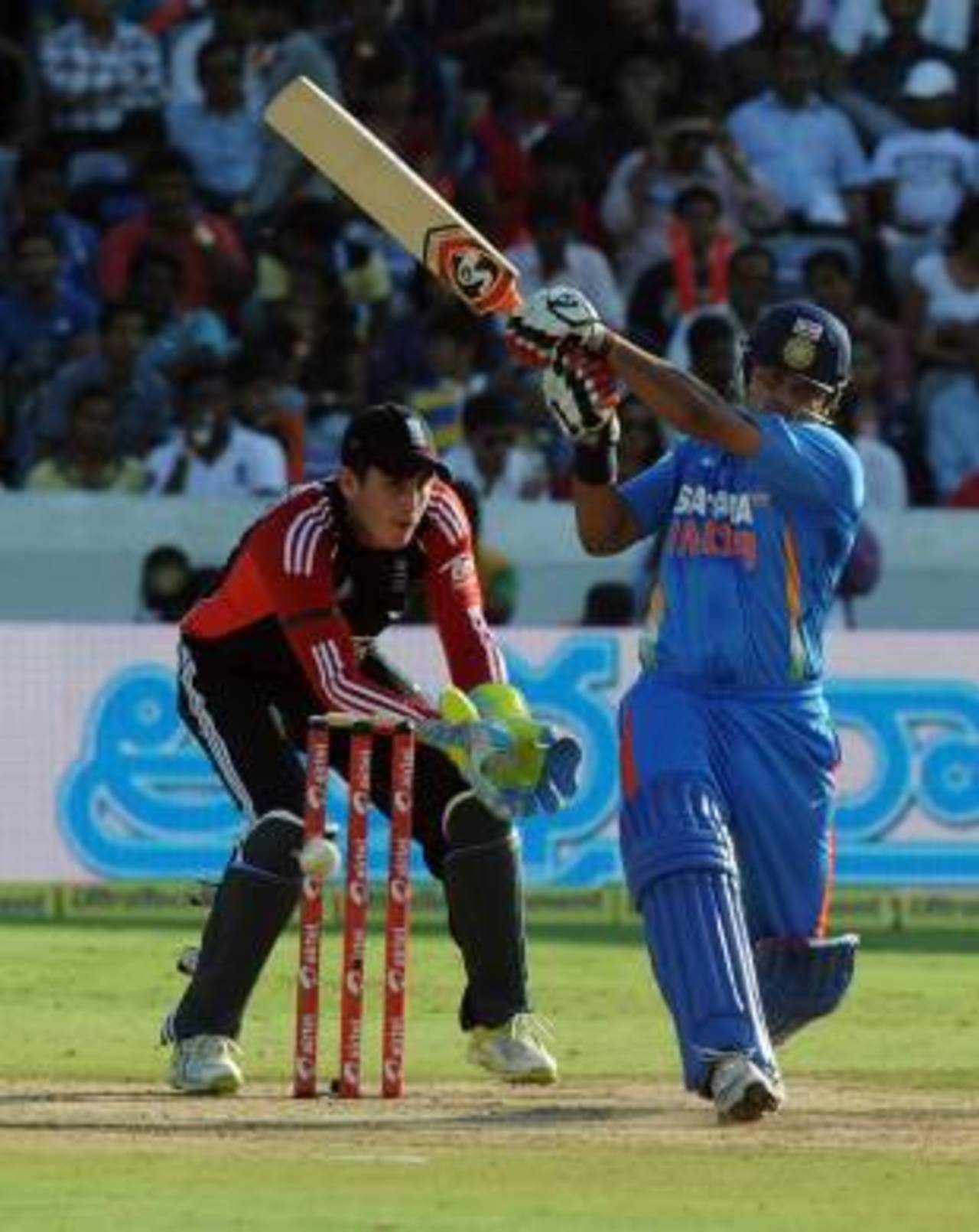 Suresh Raina tries to cut loose on a tricky pitch, India v England, 1st ODI, Hyderabad, October 14, 2011