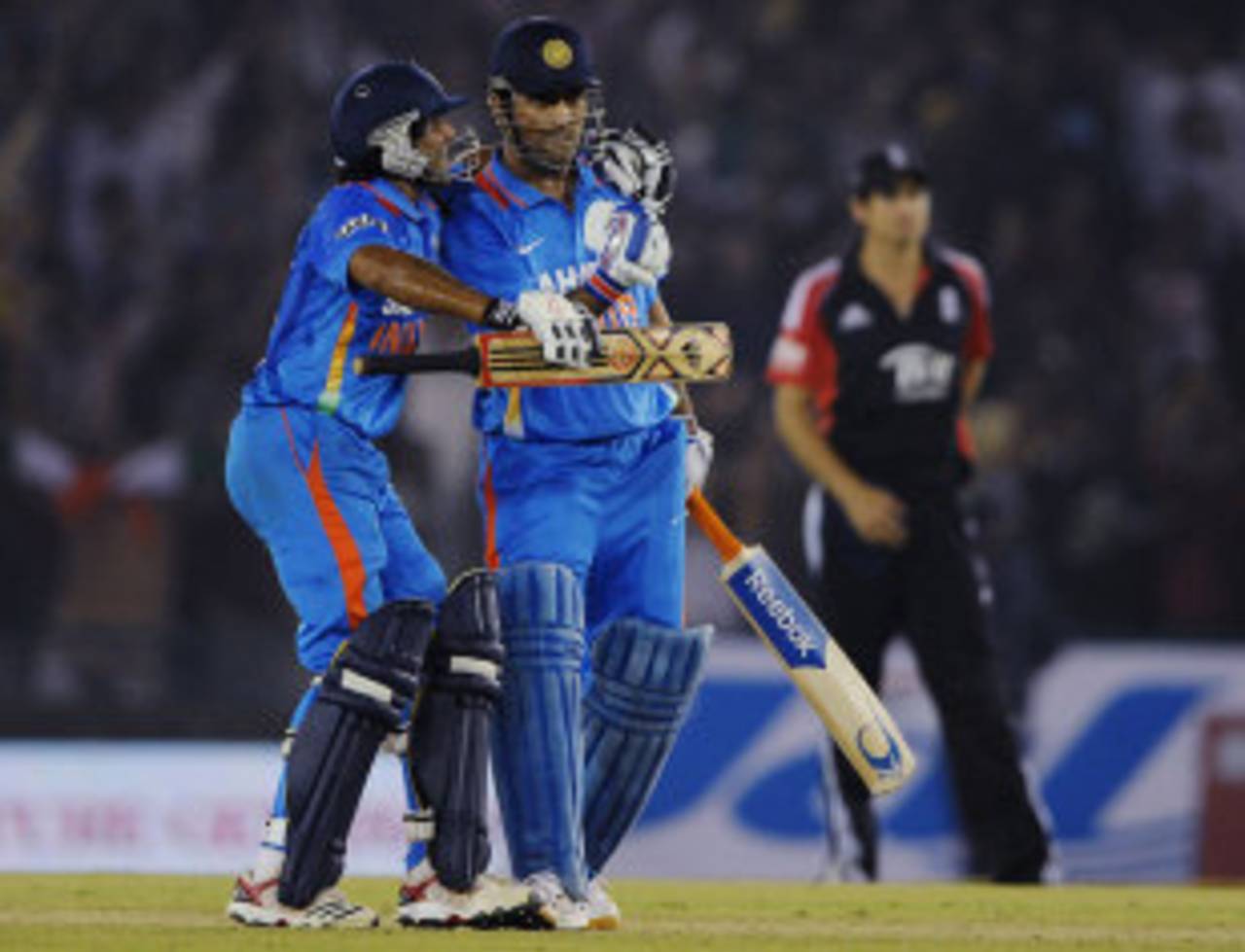 Ravindra Jadeja embraces MS Dhoni as India clinch the series, India v England, 3rd ODI, Mohali, October 20, 2011