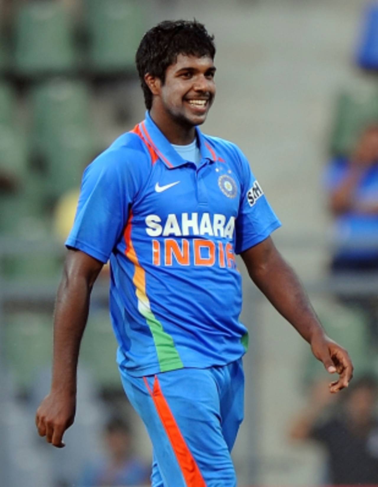 Varun Aaron had reason to smile as he picked up three wickets on debut, India v England, 4th ODI, Mumbai, October 23, 2011