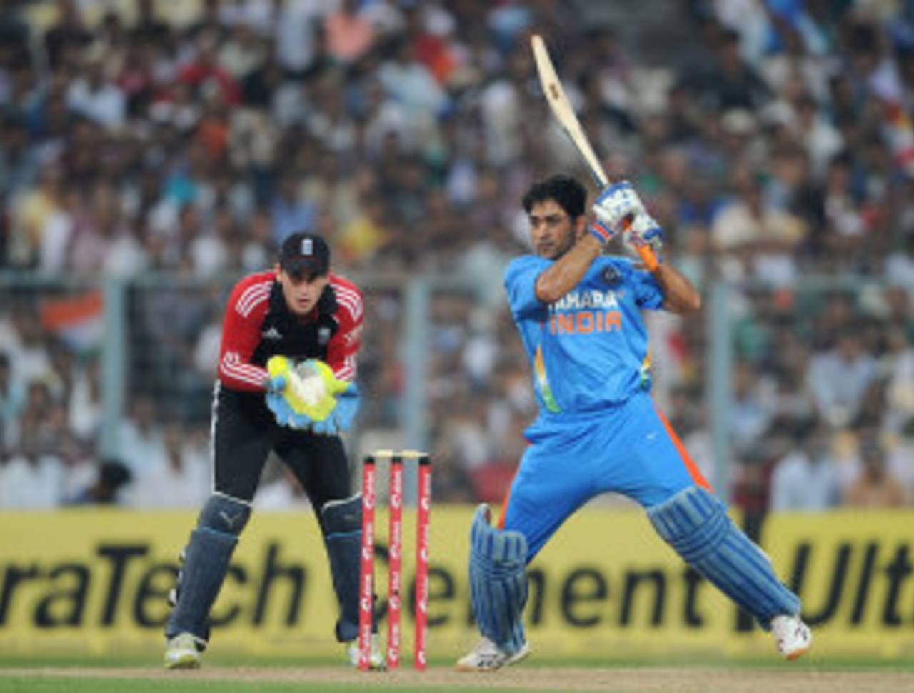 MS Dhoni drives through the off side, India v England, 5th ODI, Eden Gardens, October 25 2011
